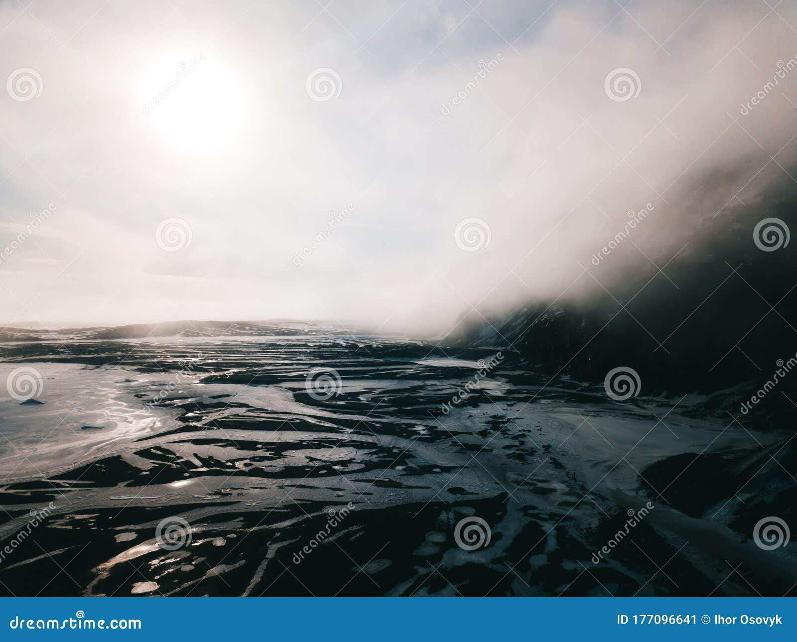 dyrfjoll mountain covered in fog and mist, iceland.