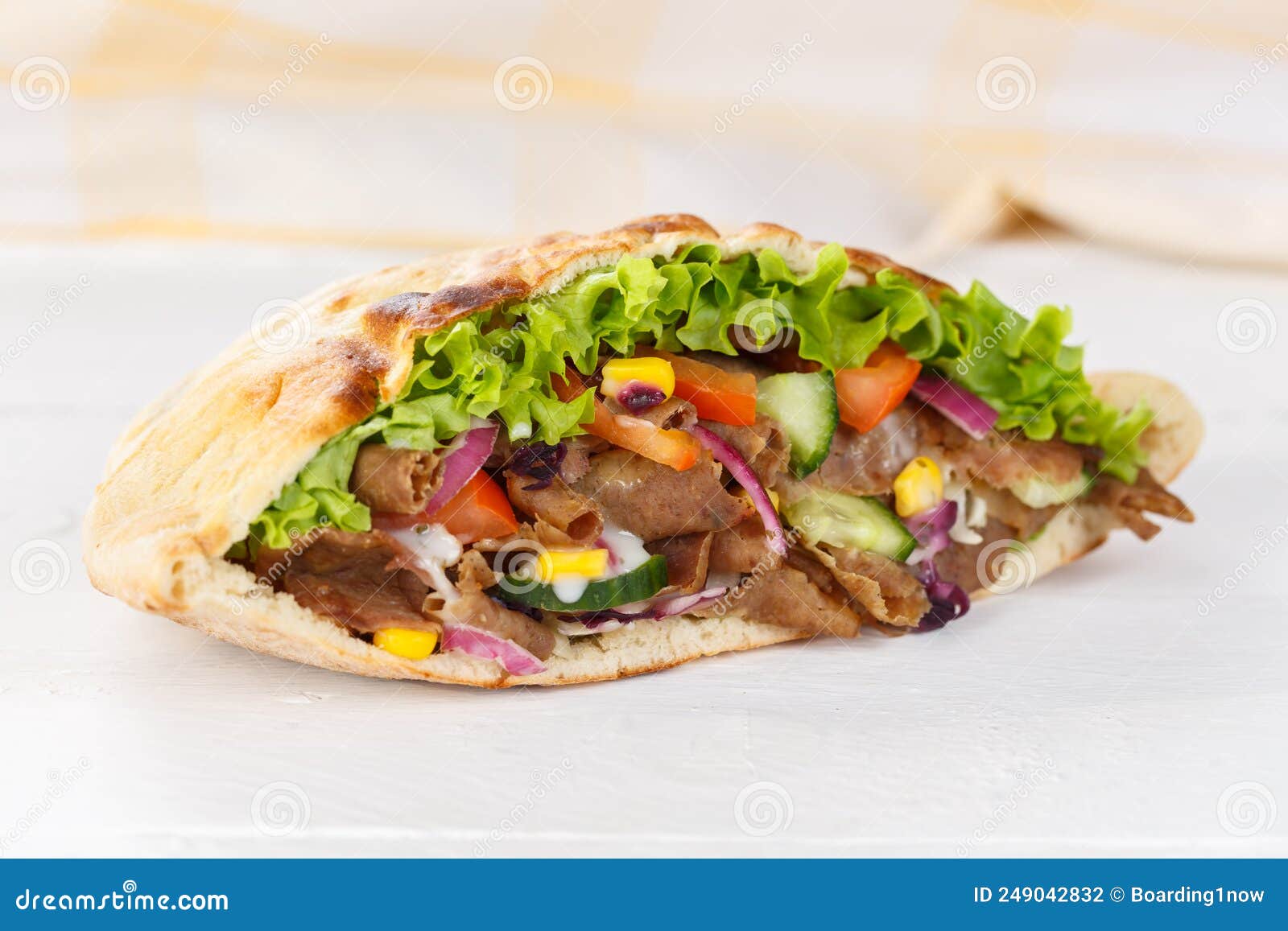 dÃÂ¶ner kebab doner kebap slice fast food in flatbread on a wooden board