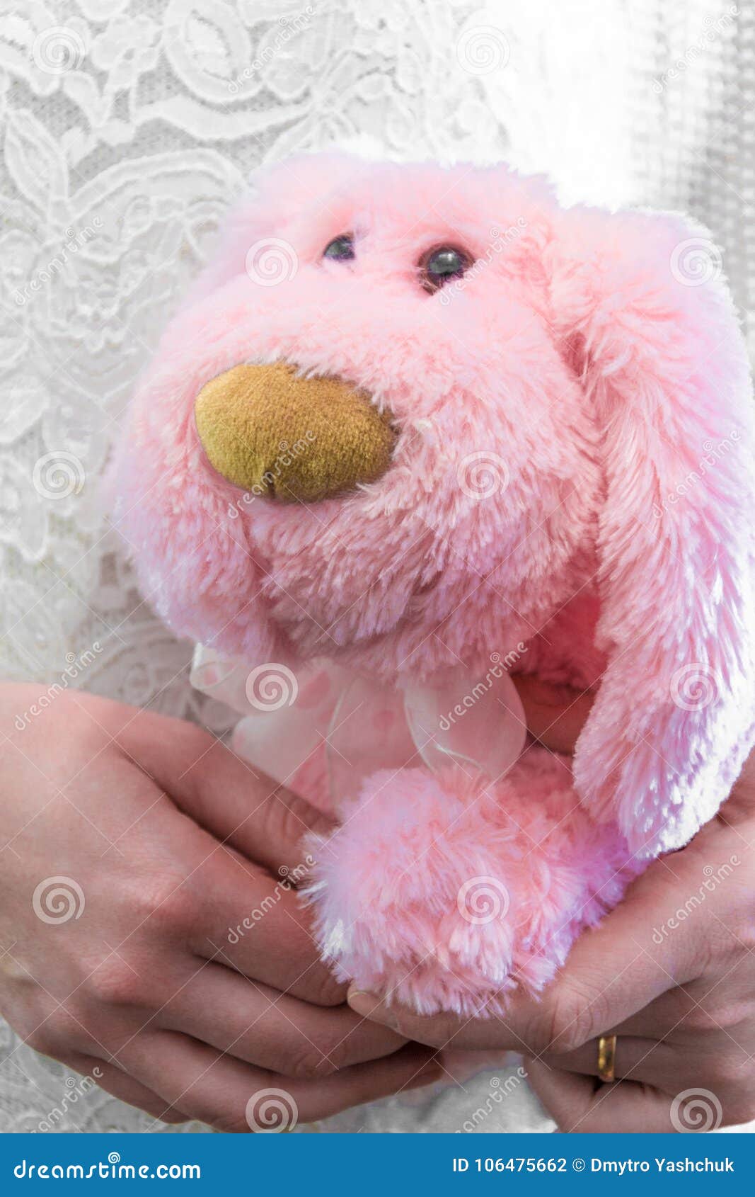 The girl holds in hands soft toy