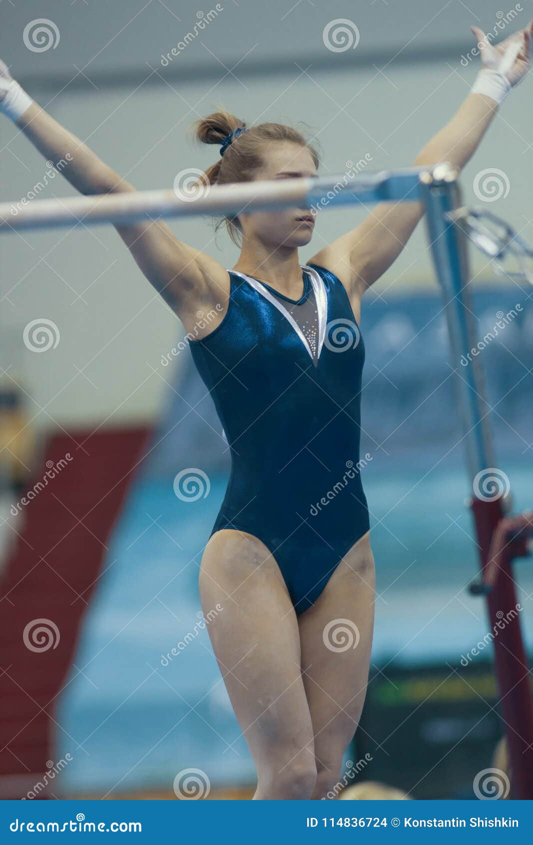 Athletic Girl Gymnast Get Ready in Uneven Bars at the Championship ...