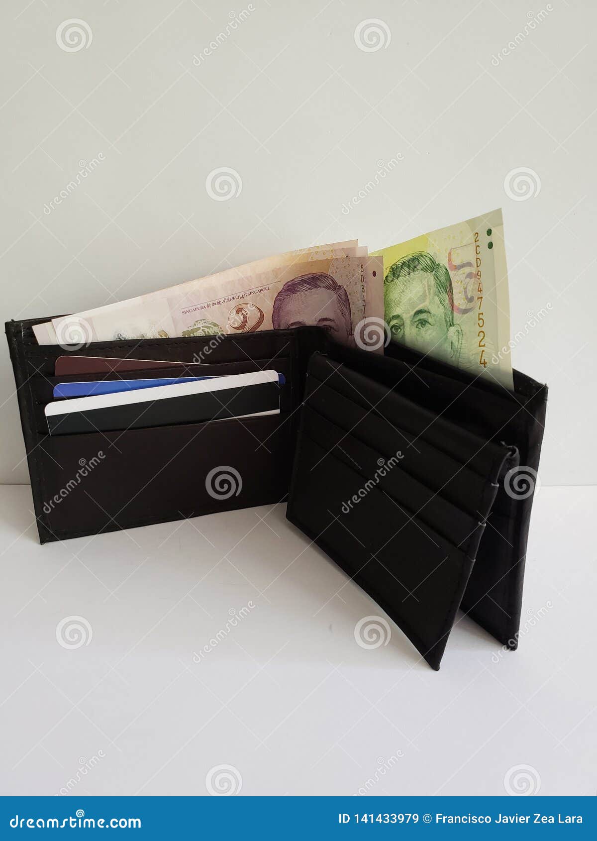 Black Leather Wallet with Singaporean Banknotes and White Background 库存