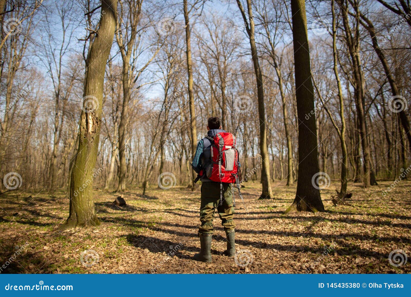 Young Man with Backpack Hiking in the Forest. Nature and Physical ...