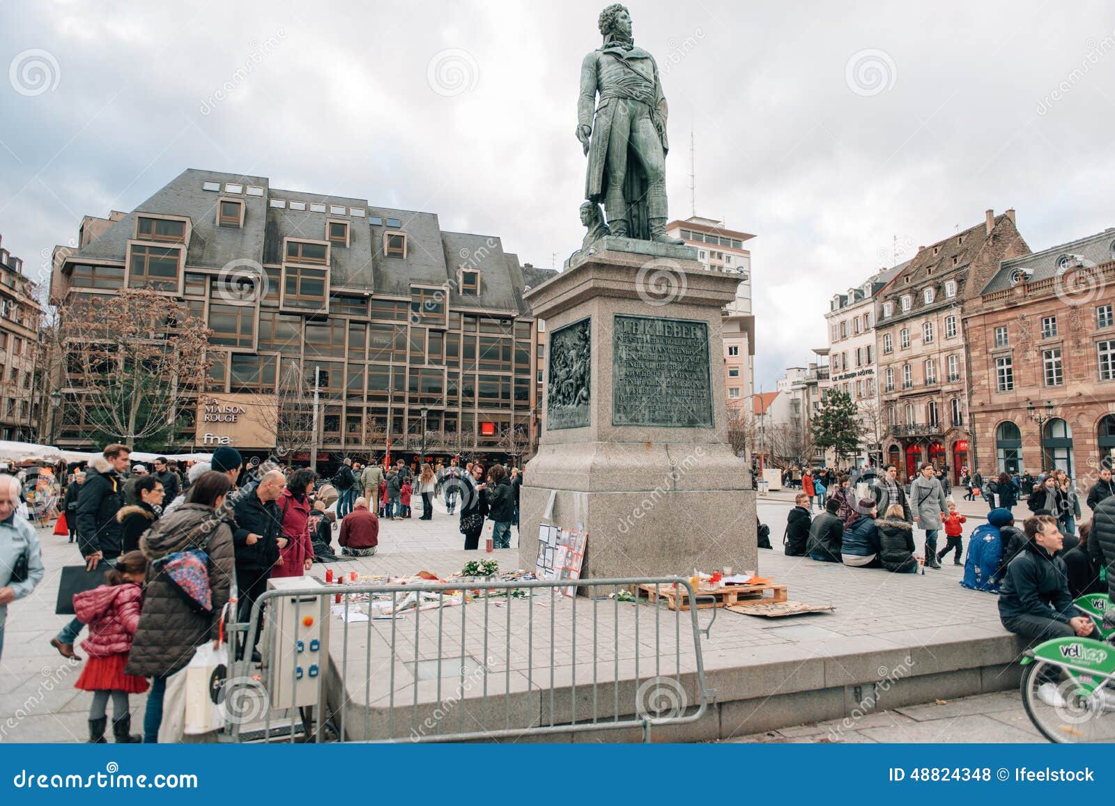 Mass unity rally held in Strasbourg following recent terrorist a. STRASBOURG, FRANCE - 10 JAN, 2015: Light candles and pencils near General Kleber statue in tribute to the victims of the terrorist attacks in Paris on January 11, 2015