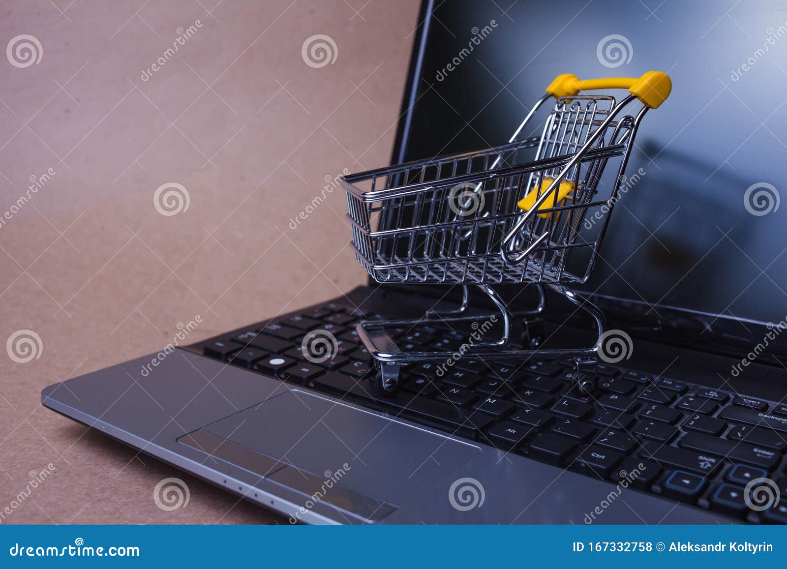 e-commerce. online shopping, shopping cart on laptop keyboard.