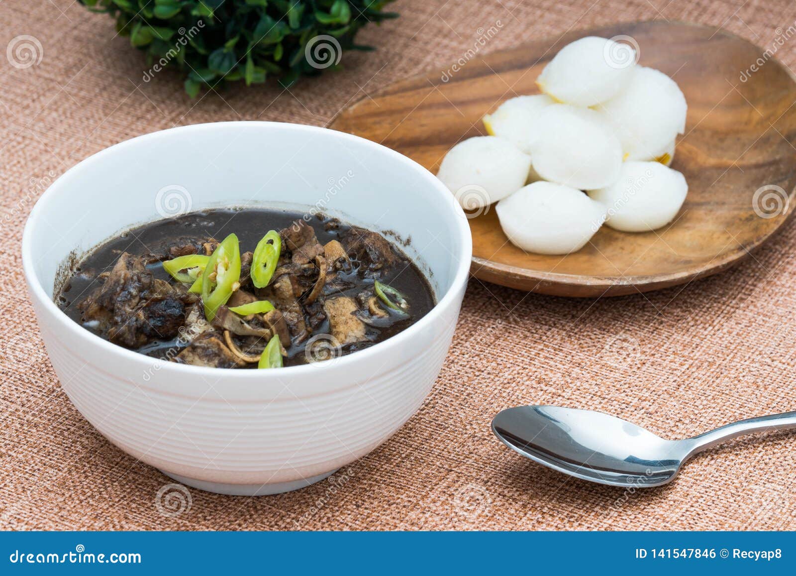 Dinuguan or Pork Blood Stew with Rice Cake on the Side Foto de Stock