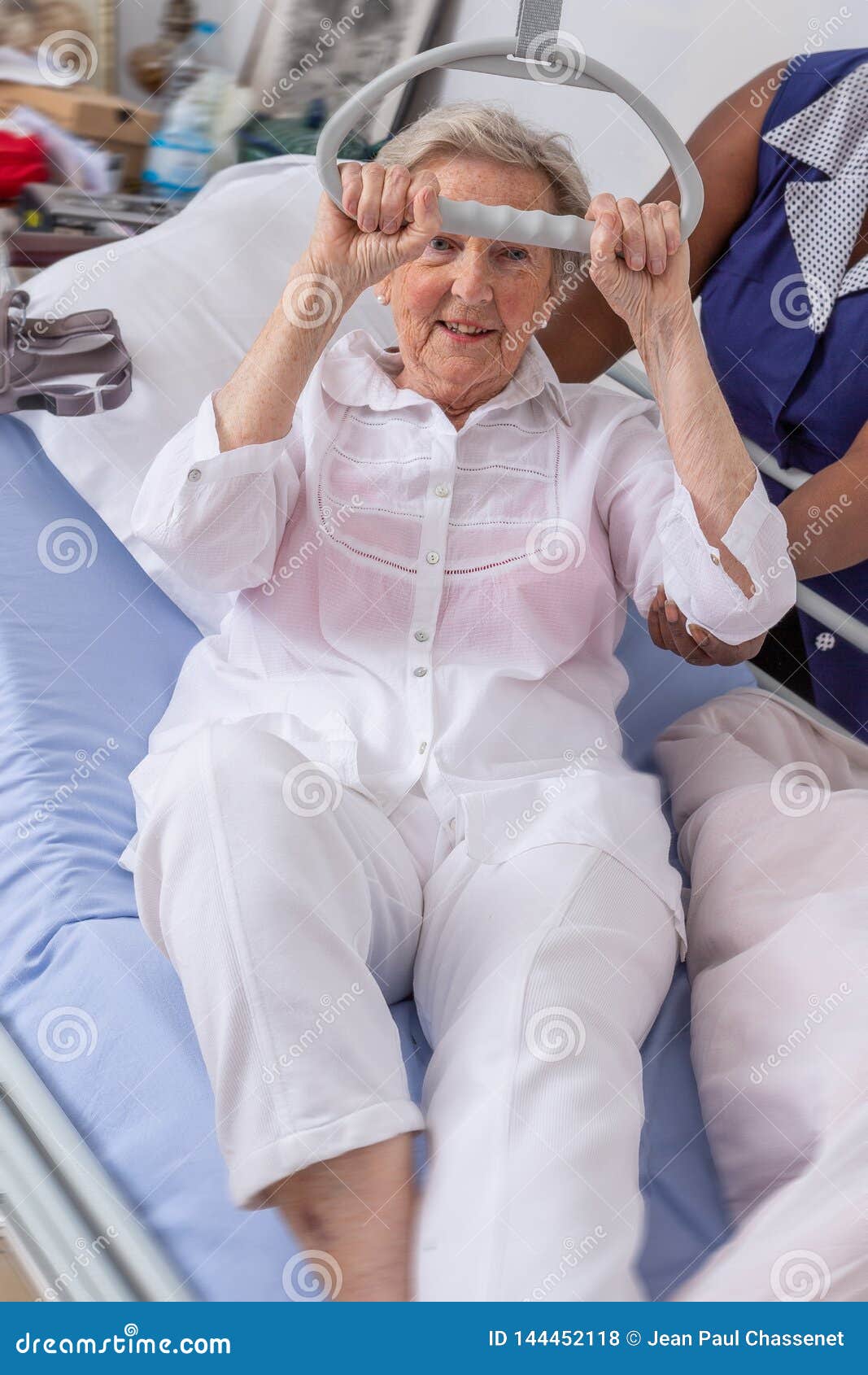 Nurse Helps A Patient To Get Up In Hospital Nurse Helping Senior Woman