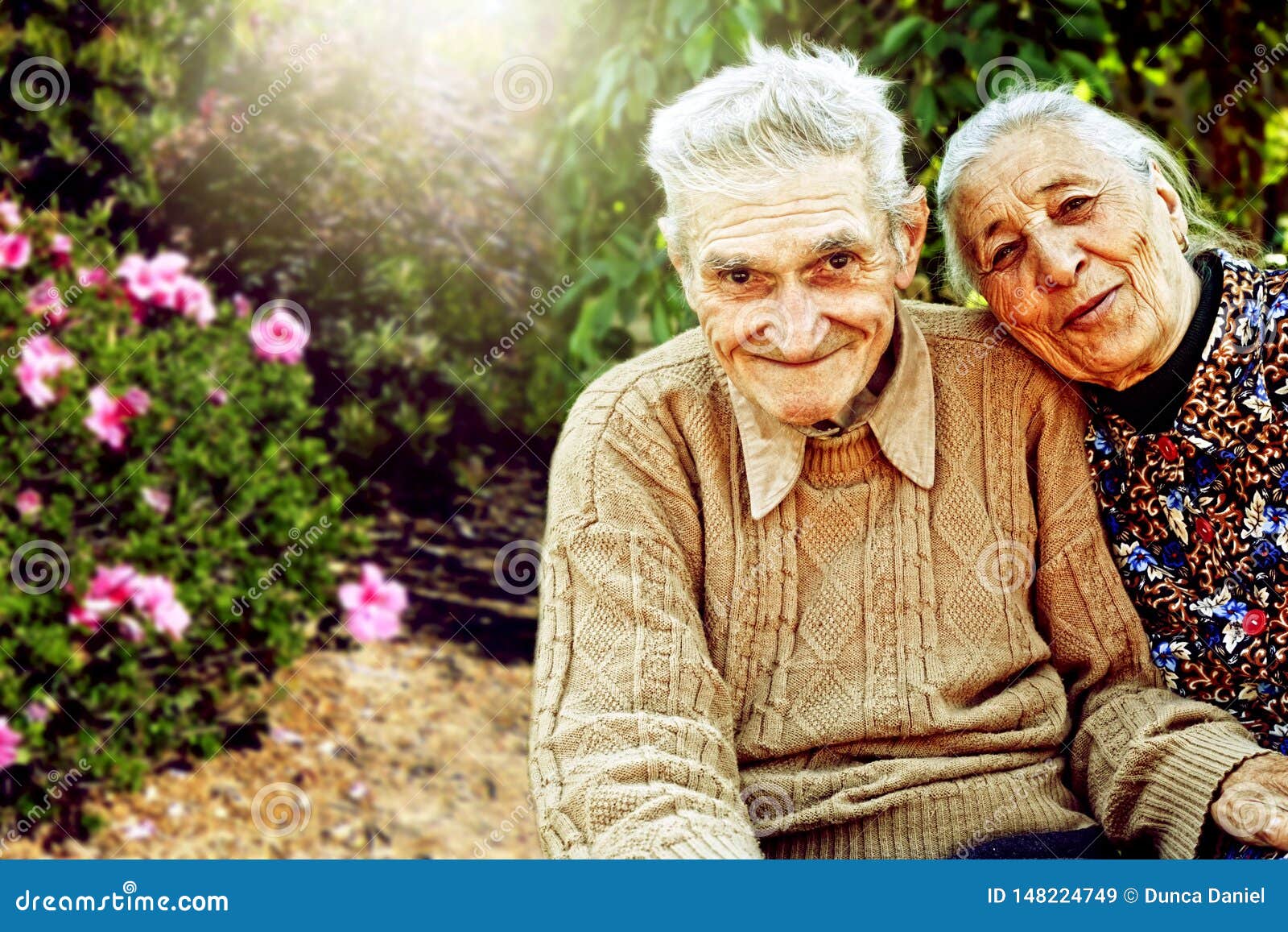 Outdoors portrait of happy senior couple. Outdoors portrait of happy senior married couple smiling and looking at camera