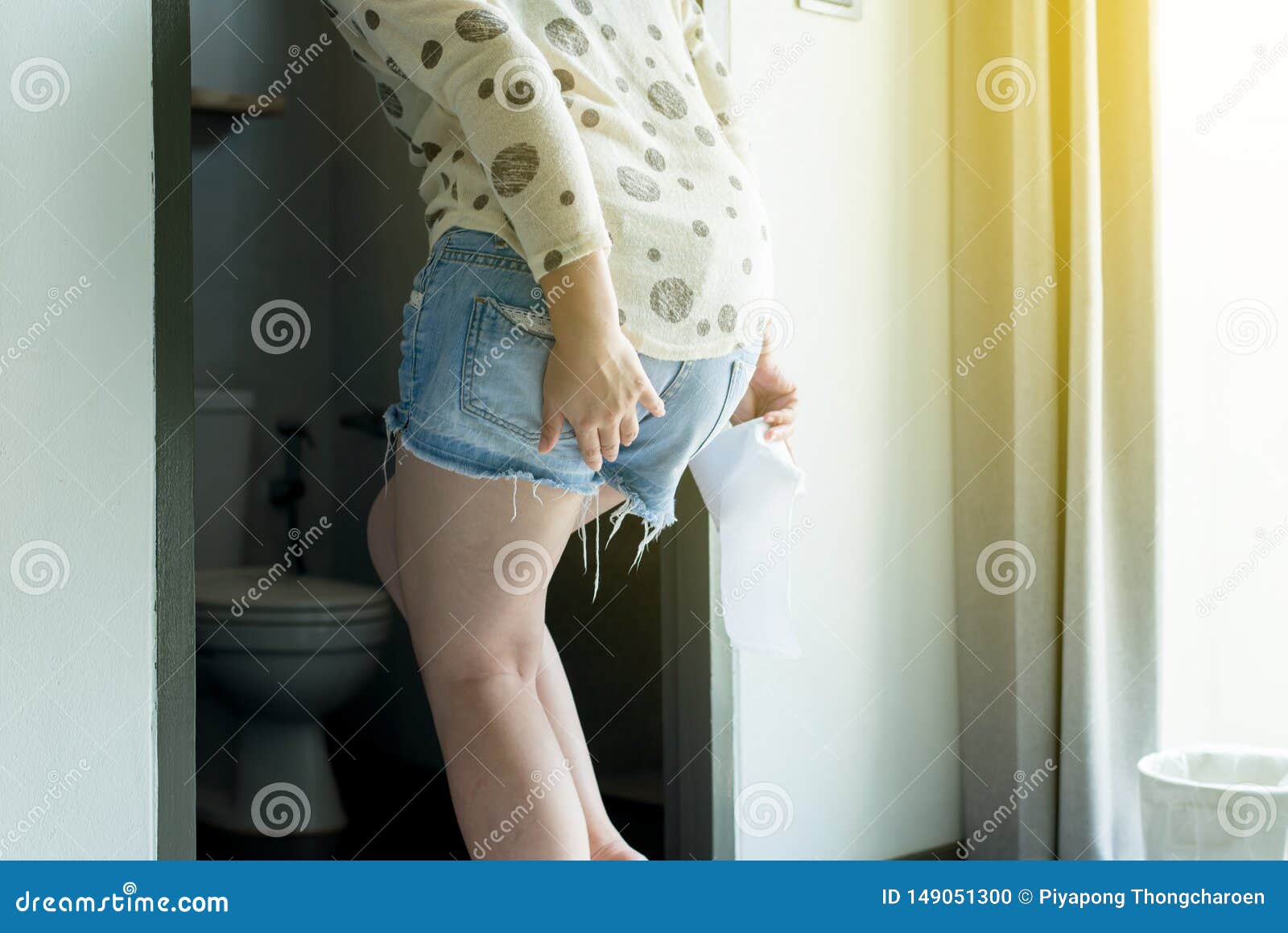 Woman Using Toilet and Suffers from Diarrhea and Hemorrhoids with