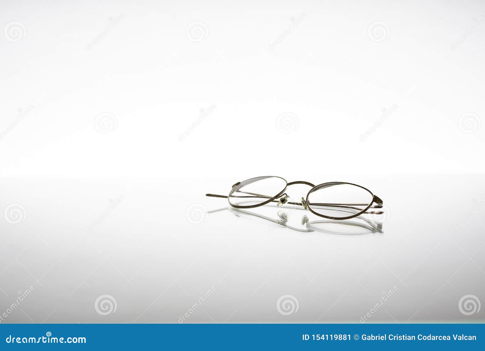 Golden Metallic Eyeglasses for Vision Issues or Protection, Isolated on