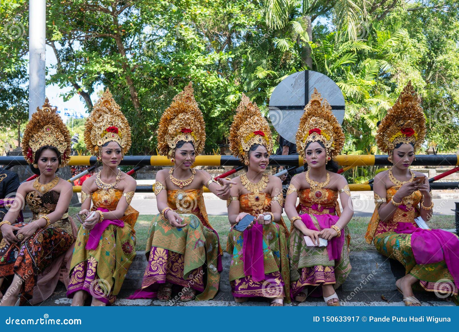 DENPASAR/BALI-JUNE 15 2019: Young Balinese women wearing traditional Balinese headdress and traditional sarong at the opening. R r o