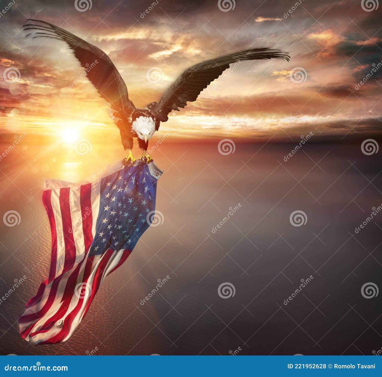 eagle with american flag flies in freedom at sunset