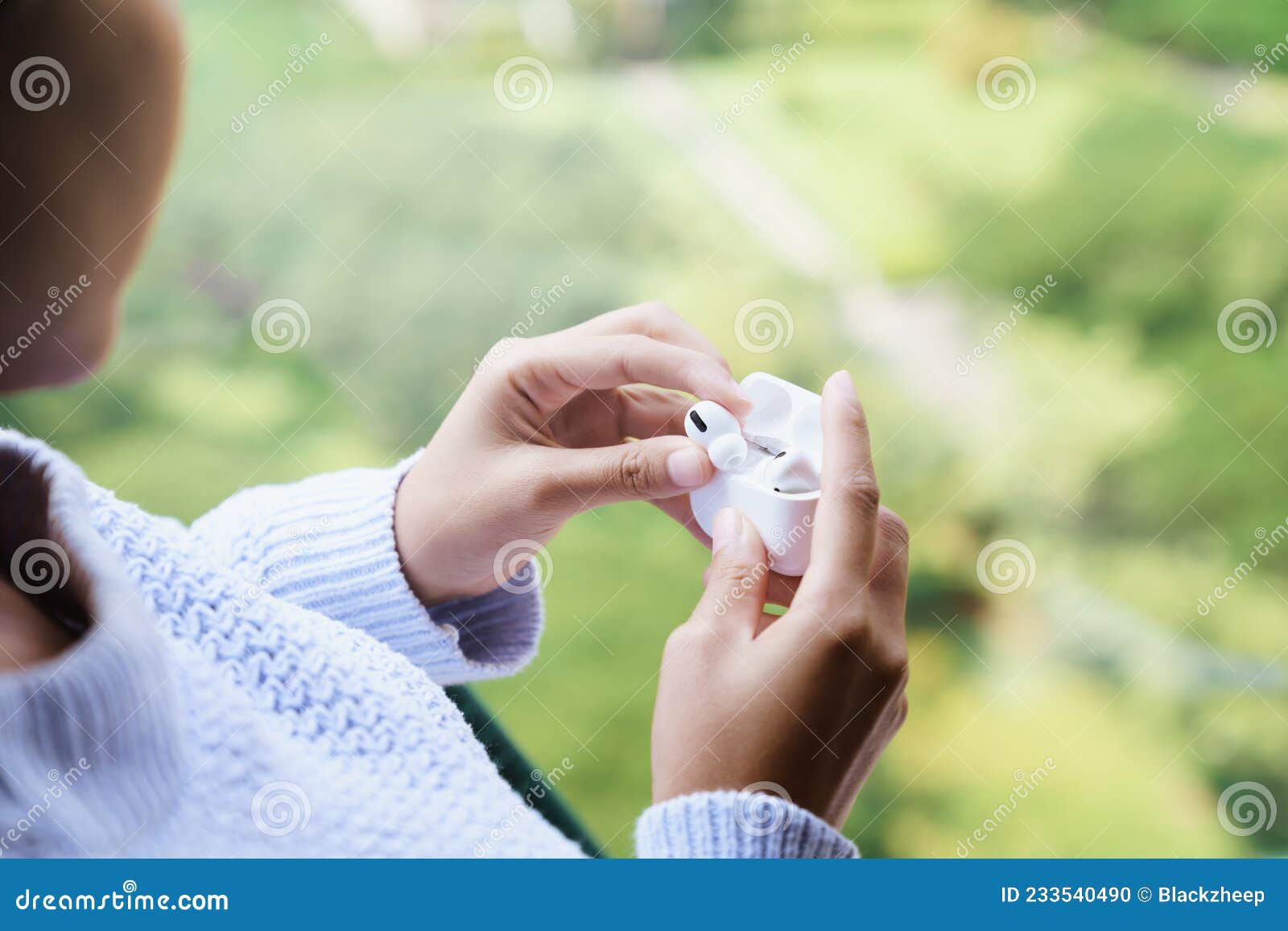 Earbuds in Female Hand, New Headphone Technology Stock Photo Image of