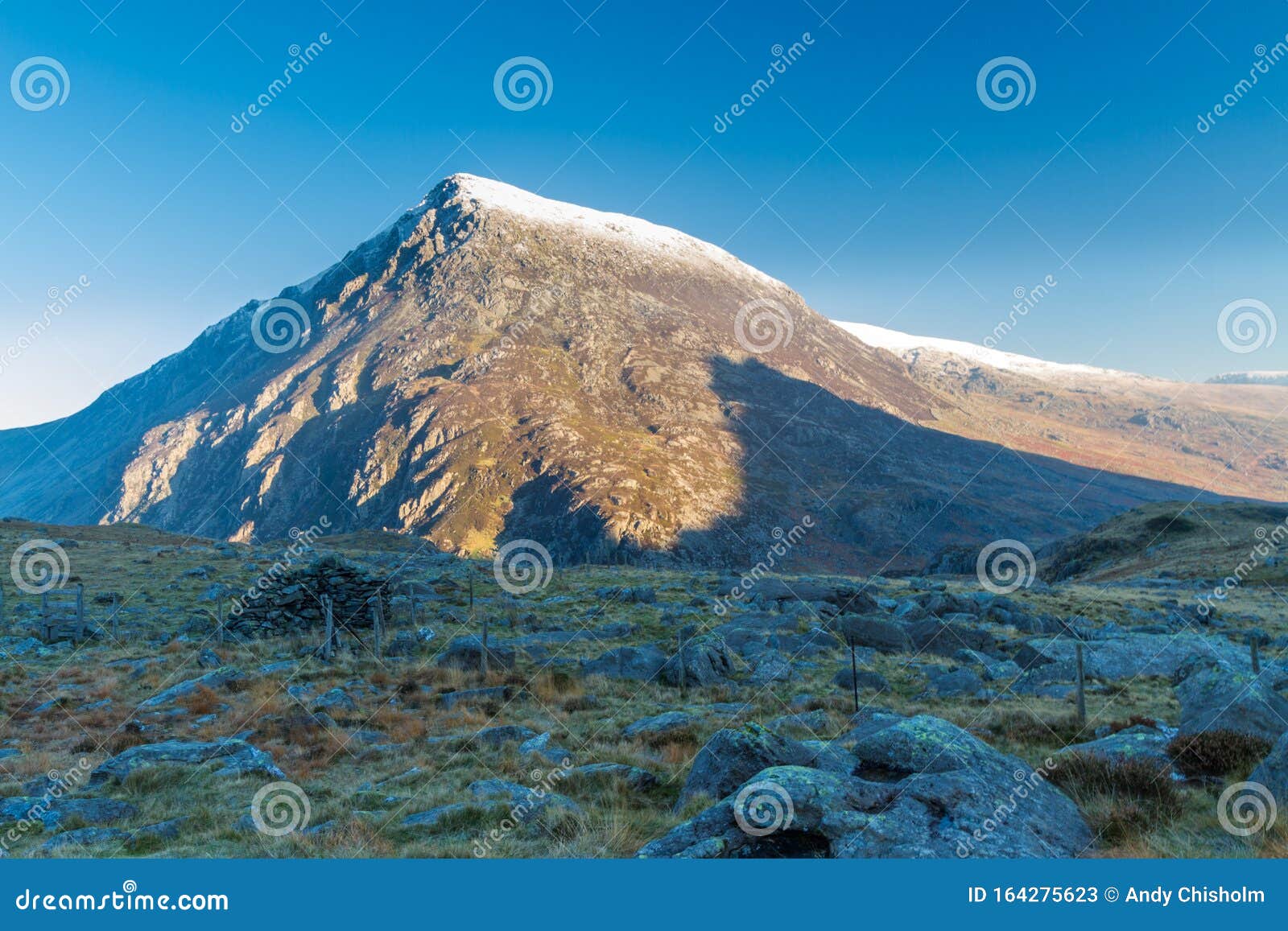 early morning light and shadow over mountains and snow. carnedd llewelyn. landscape