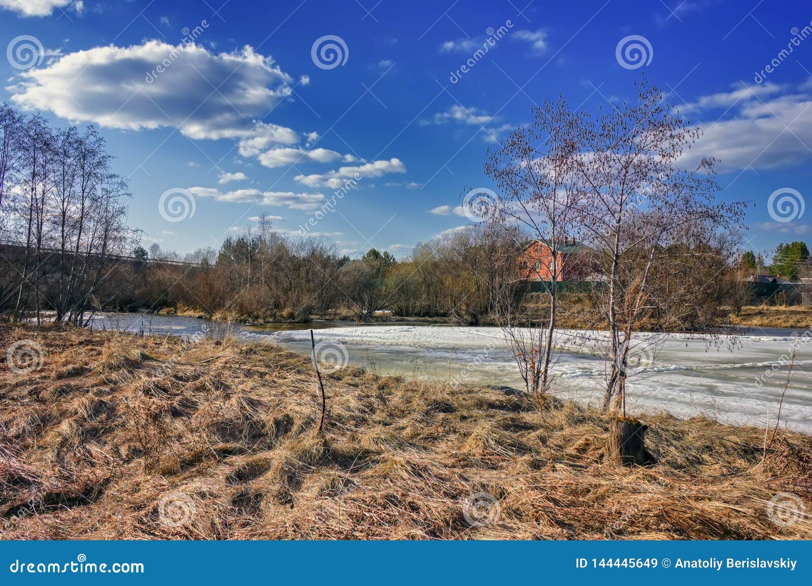 Early Spring Landscape Melts Ice on a Small River at the Edge of the