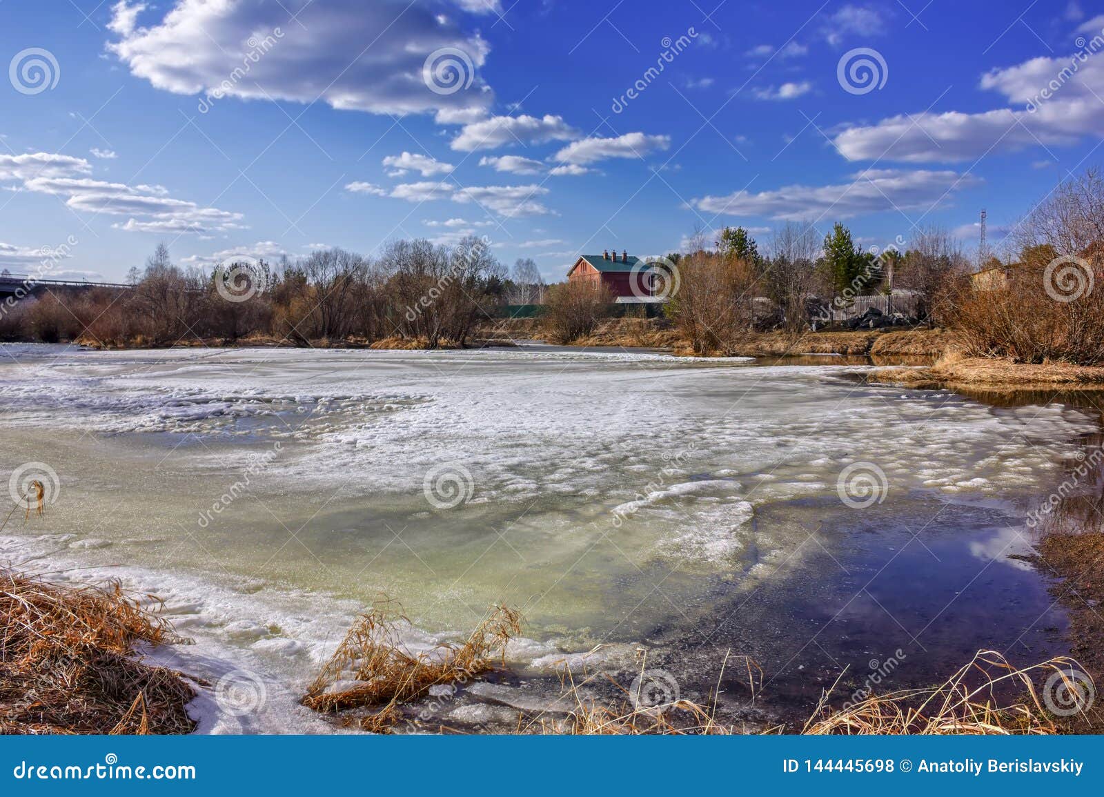 Early Spring Landscape Melts Ice on a Small River at the Edge of the