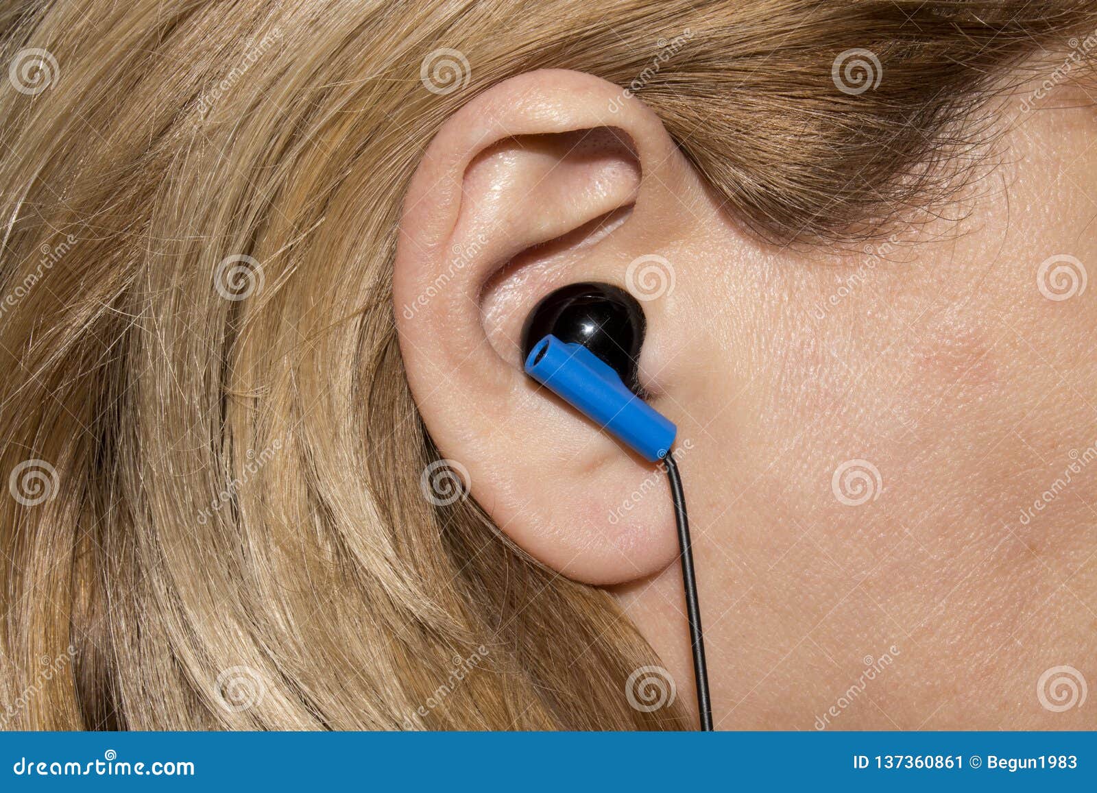 Earpiece in the human ear. stock image. Image of attractive 137360861
