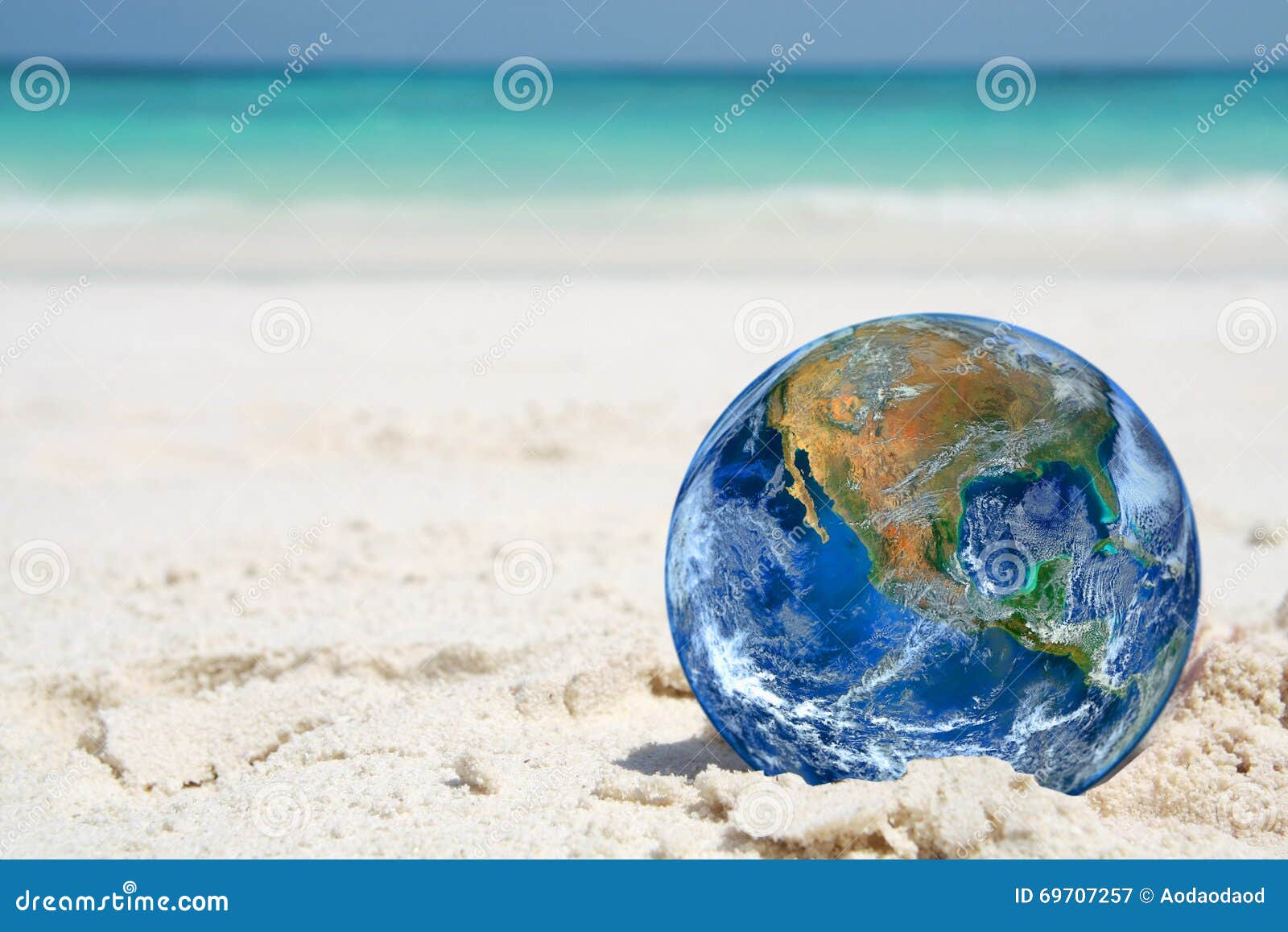 The Earth on Sand Beach, Including Elements Furnished by NASA Stock