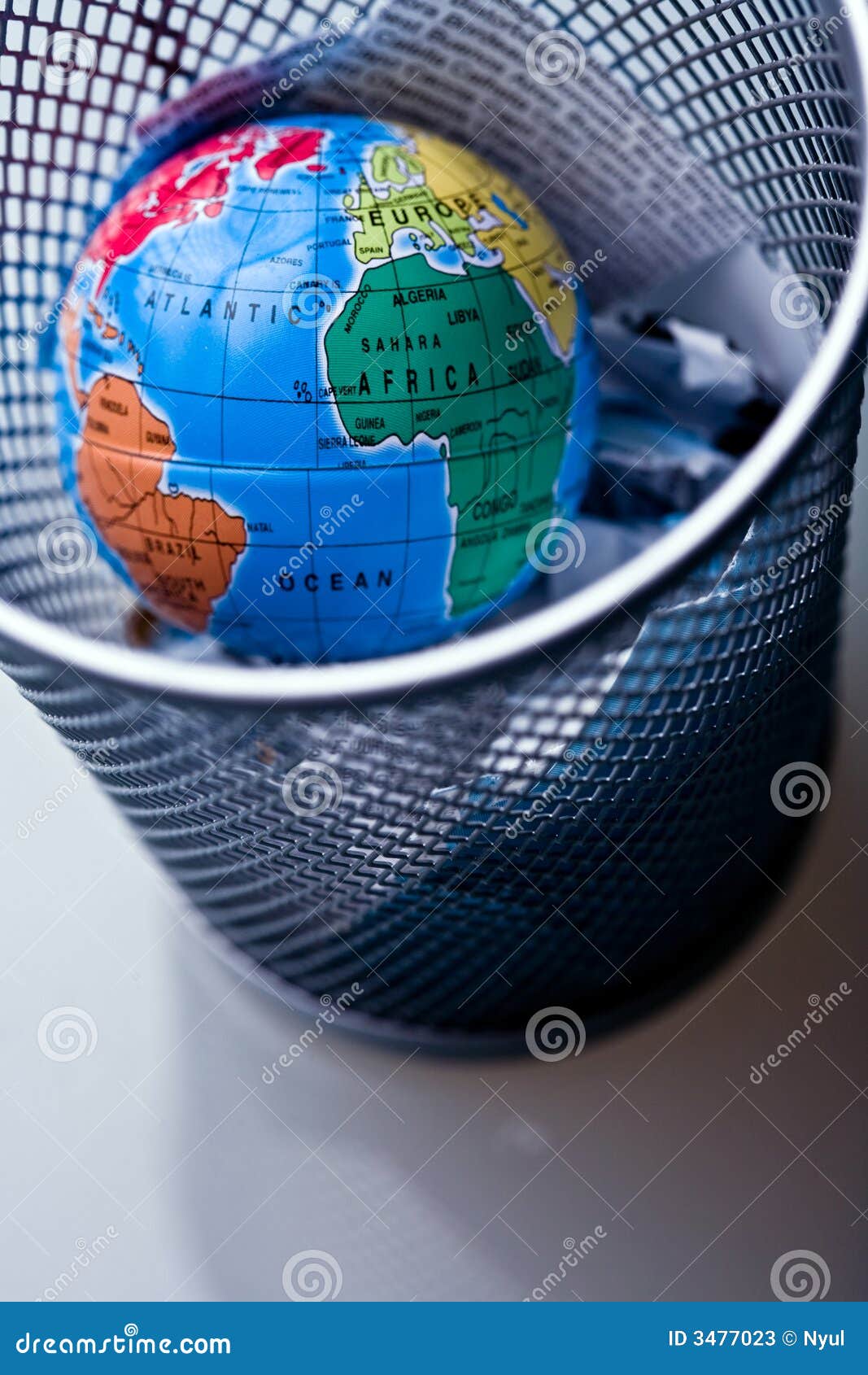 Earth in wastebin stock image. Image of waste 3477023
