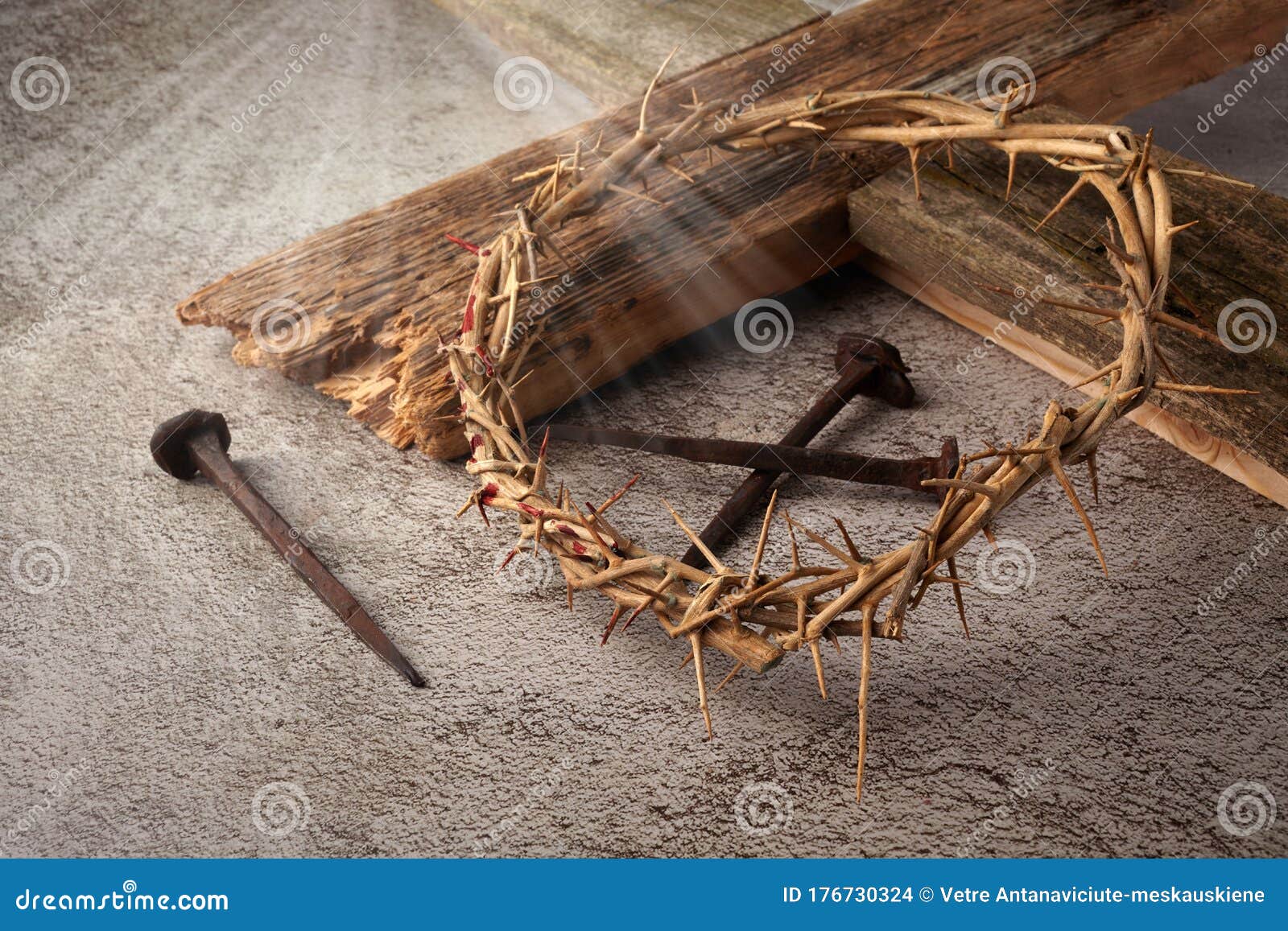 easter background depicting the crucifixion with a rustic wooden cross, crown of thorns and nails.