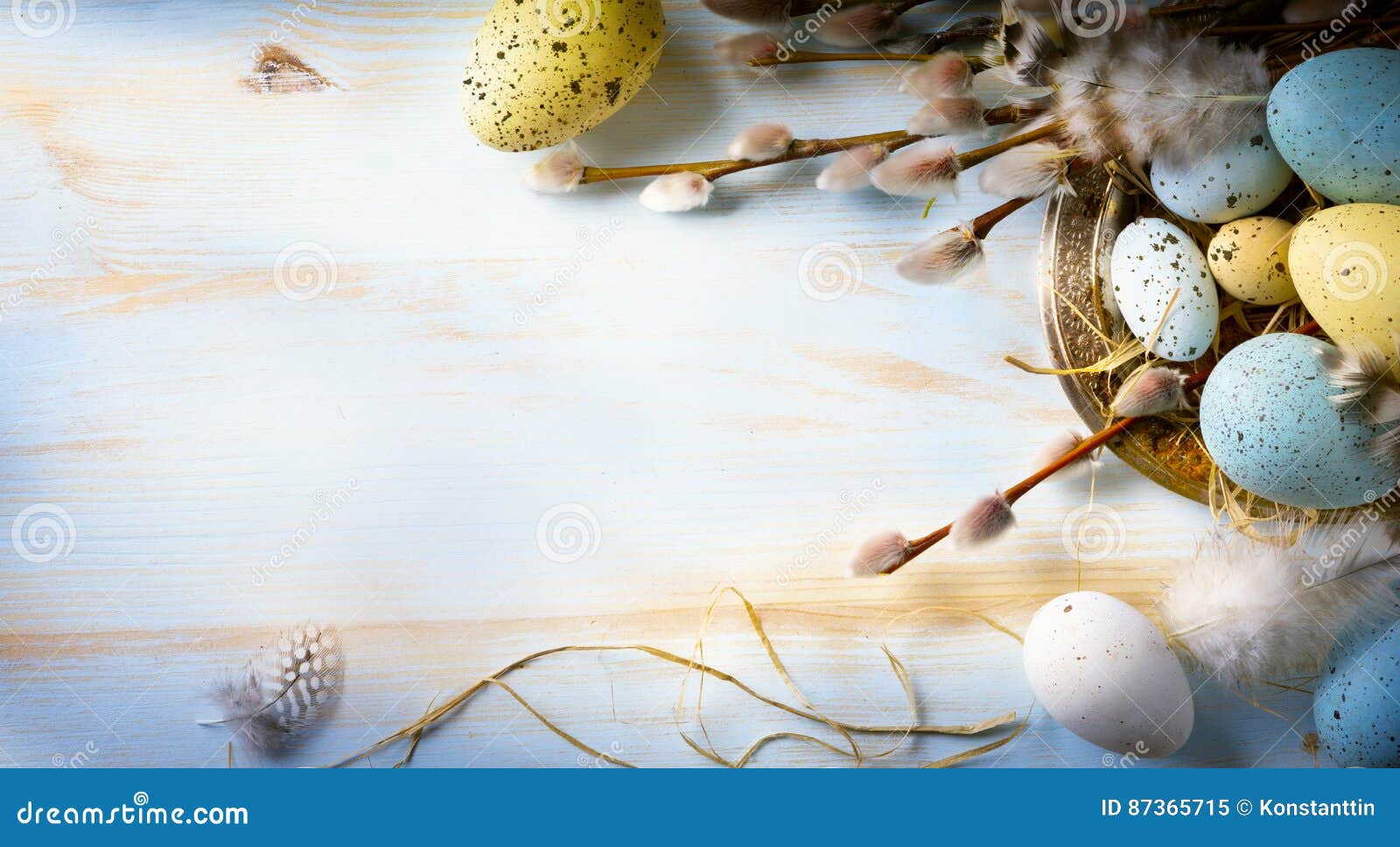 easter background with easter eggs and spring flowers. top view