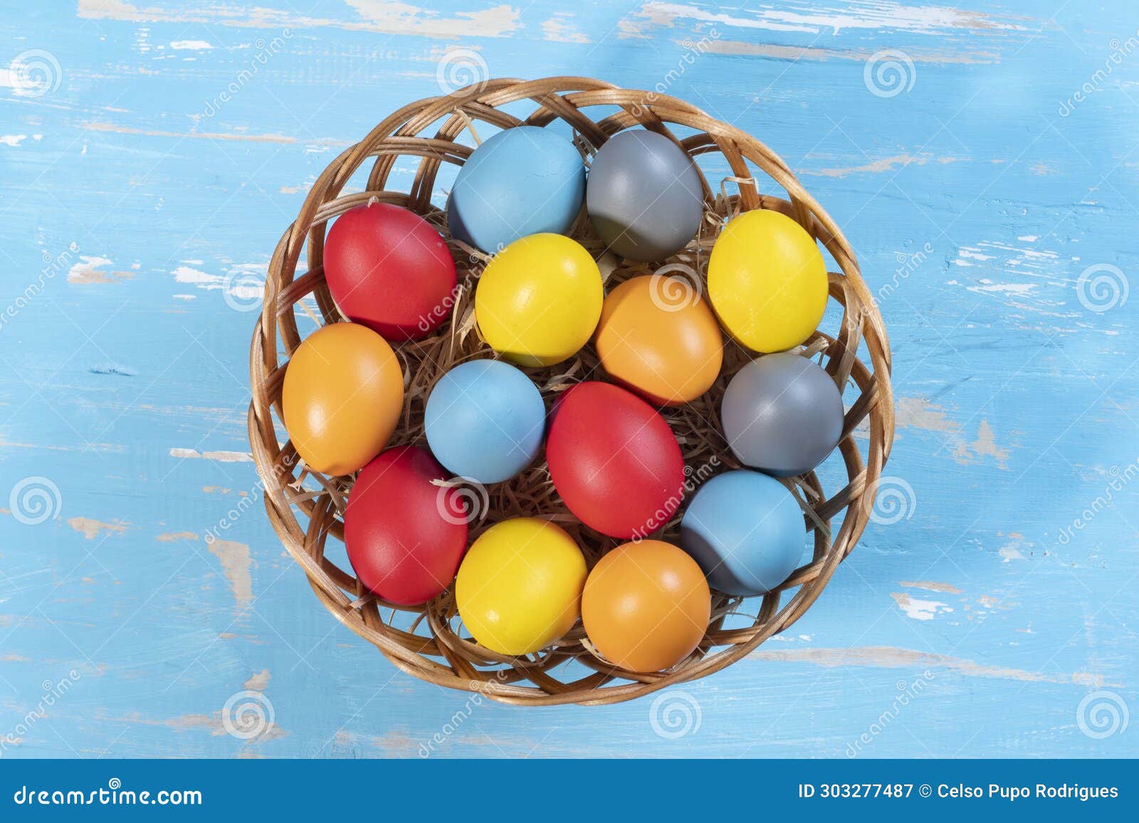 Easter Basket with Straw and Colored Eggs Stock Image Image of