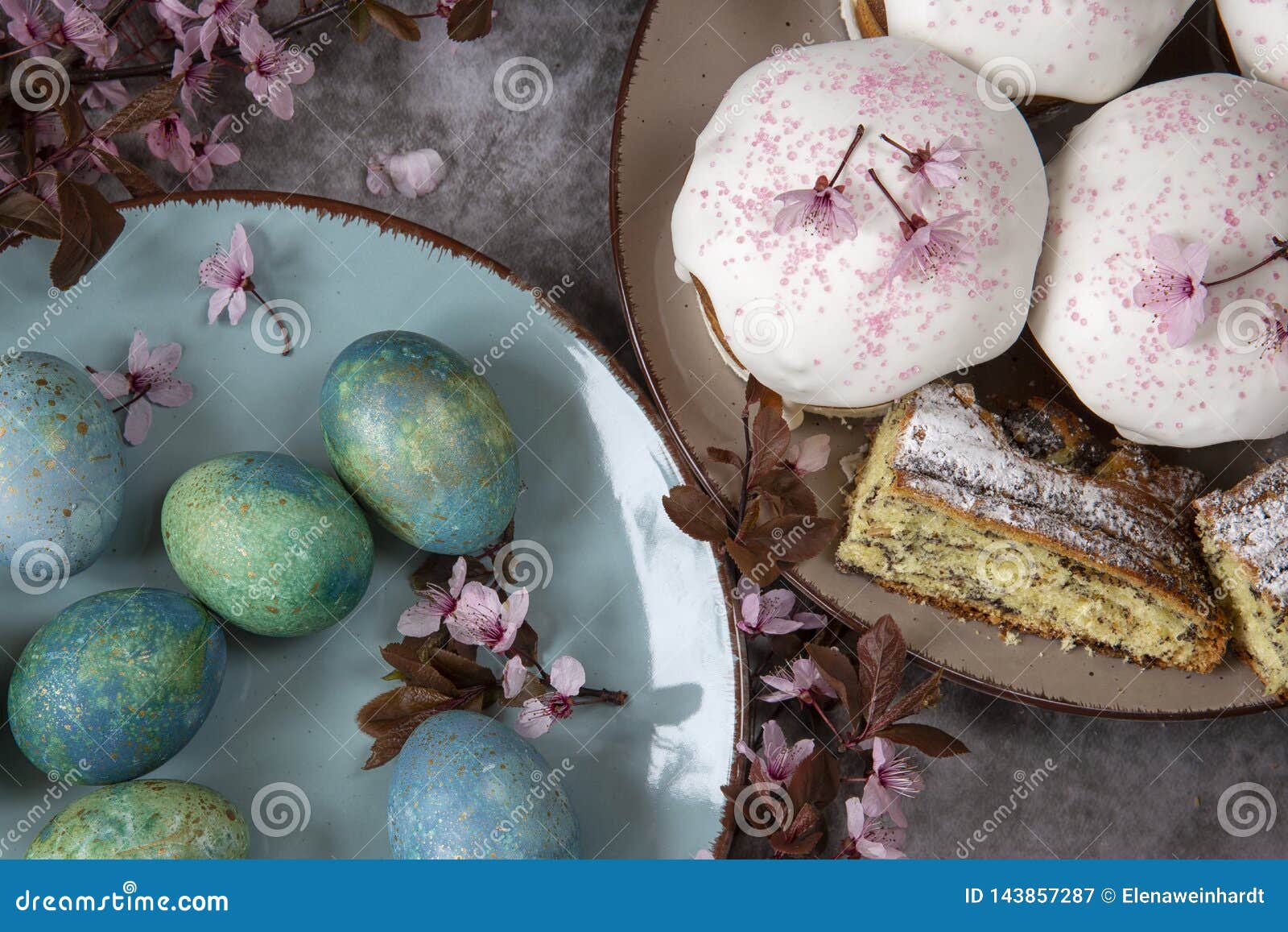 spring theme.easter bread and eggs with flowering twigs .