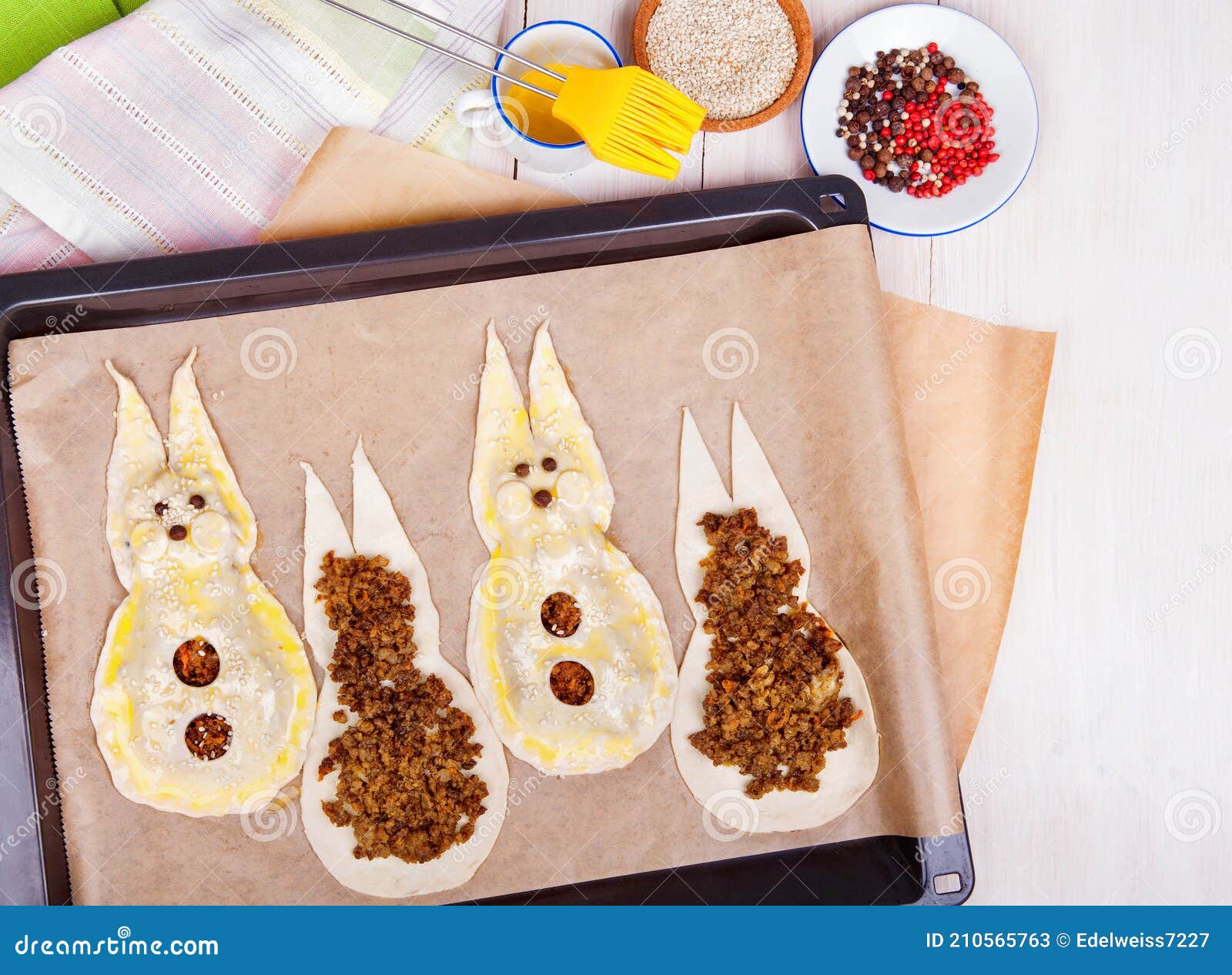 Easter Bunny Cakes and Eggs Over White Wooden Background. Puff Pastry