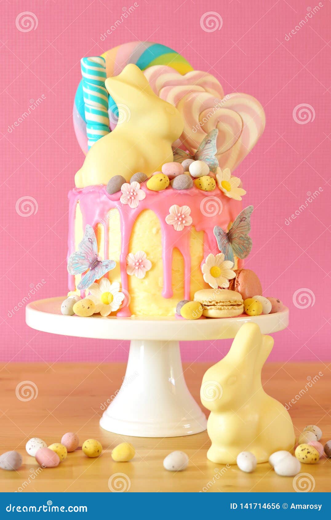 Easter Candy Land Drip Cake Decorated with Lollipops and White Bunny ...