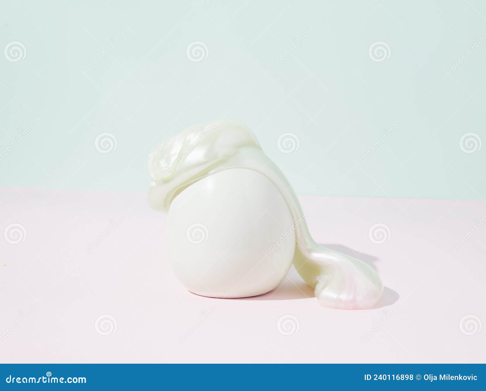 easter egg covered with slime. conceptual setting pastel background