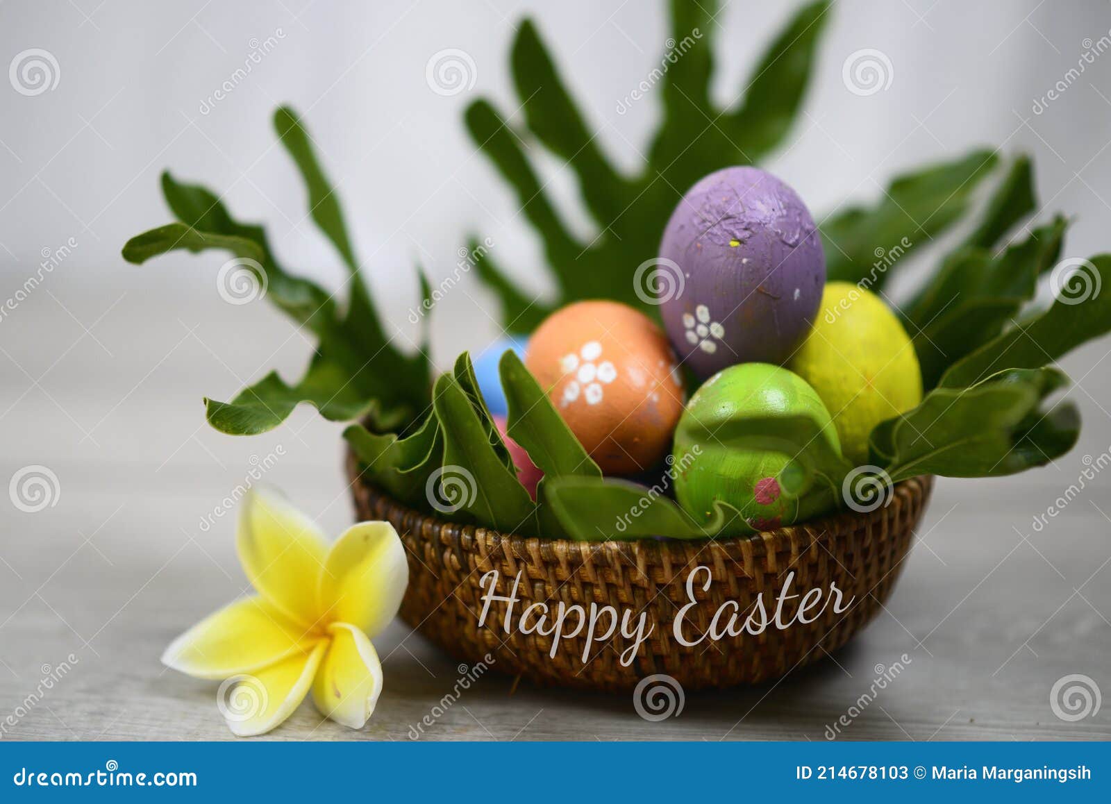 easter eggs in a basket with flower. sets of colorful easter eggs with different texture and patterns in natural rattan basket.