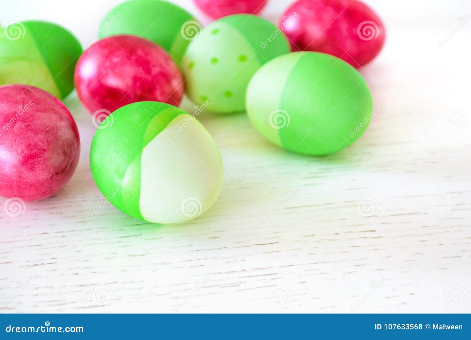 Easter Eggs Colored in Green and Pink Colors on White Wooden Tab Stock ...