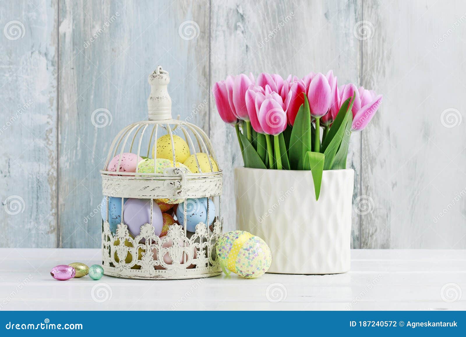 Easter Eggs Inside a Vintage Bird Cage and Bouquet of Pink Tulips in ...