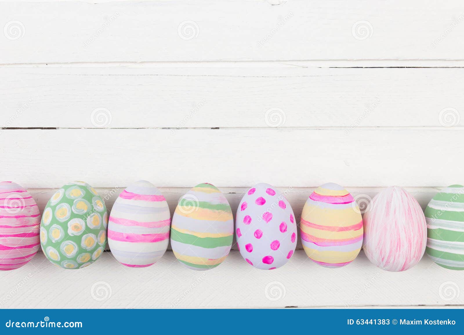 Easter Eggs Painted in Pastel Colors on a White Wood Stock Image