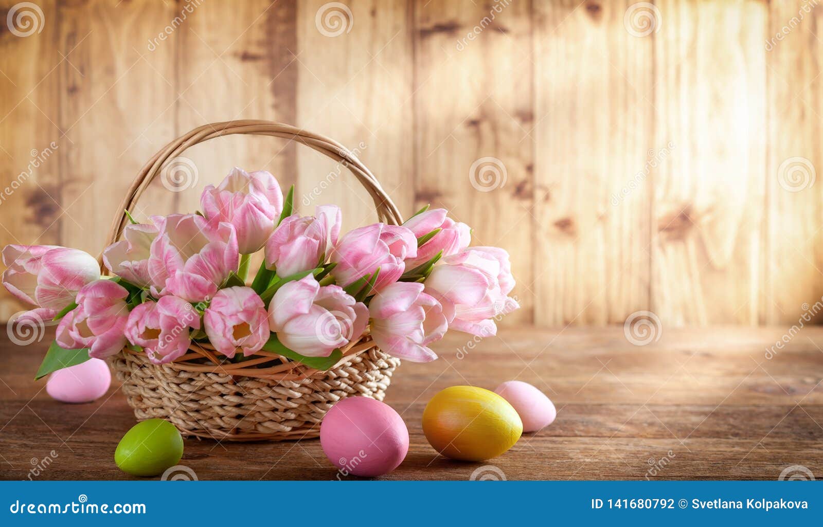 Easter Holiday Basket with Beautiful Pink Tulips and Easter Eggs Stock ...