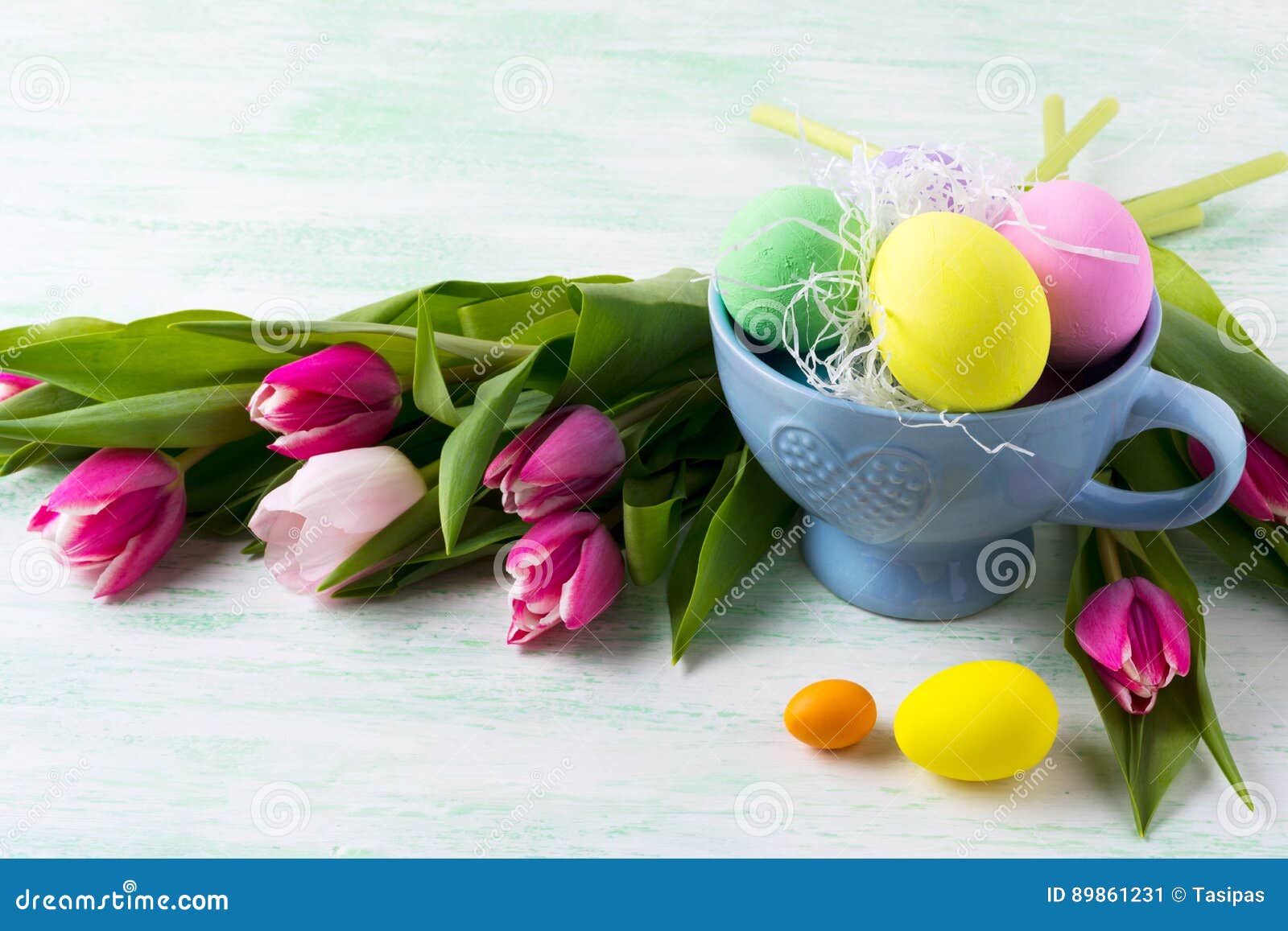 Easter Purple, Pink, Green, Yellow Eggs in Blue Cup and Pink Tulips ...