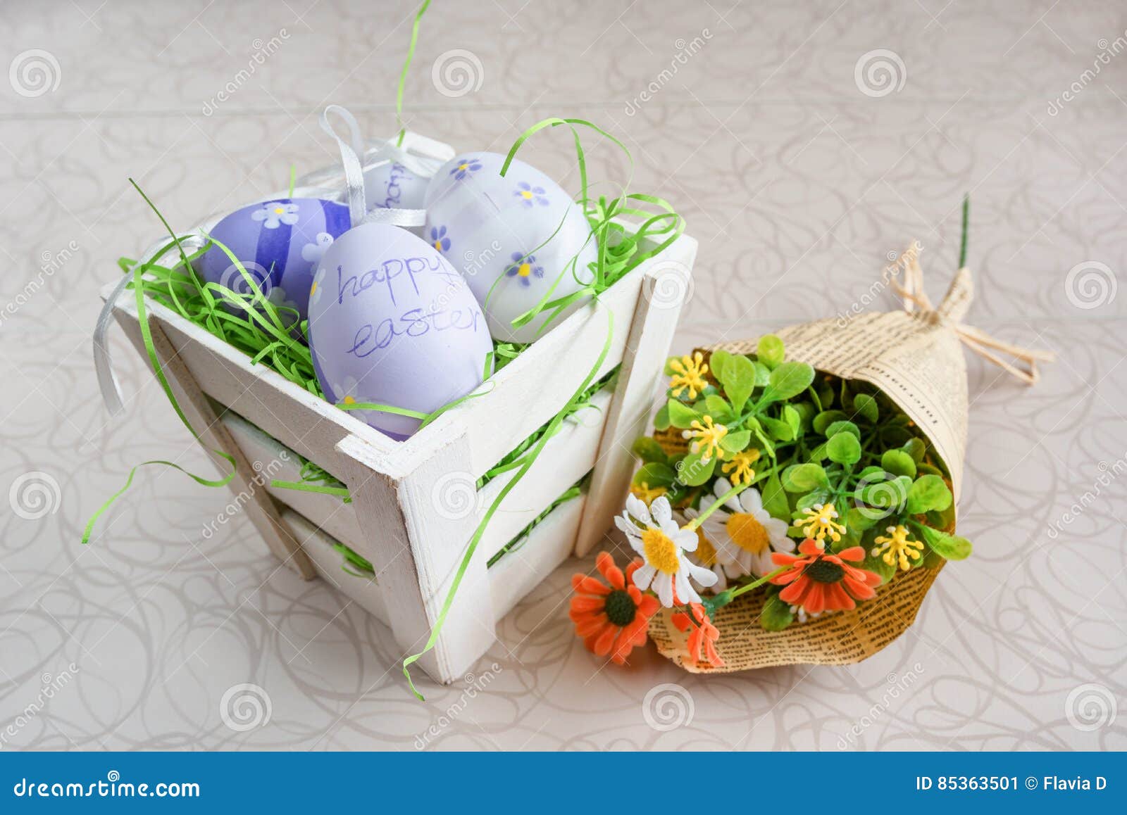 Easter Small Basket with Colored Eggs and a Bunch of Spring Flowers on