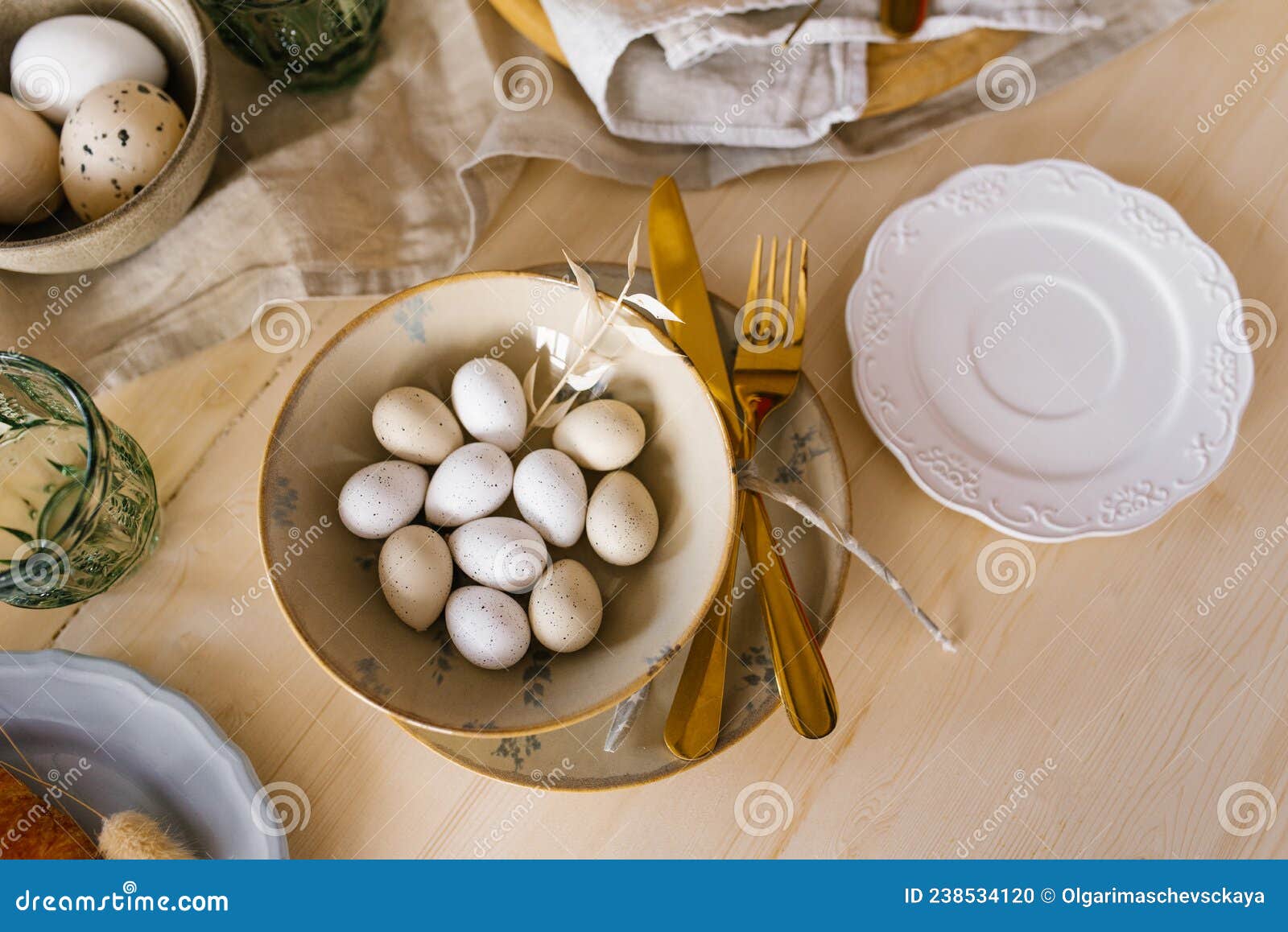 easter table setting with eggs in a plate. serving a festive breakfast or lunch. flat lay