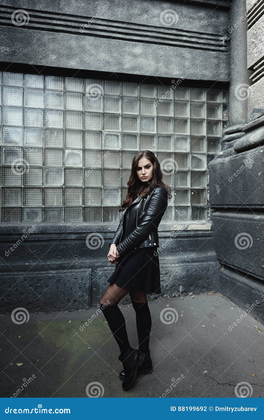 Eastern Beautiful Woman Wearing Biker Jacket Poses in Backyard of ...