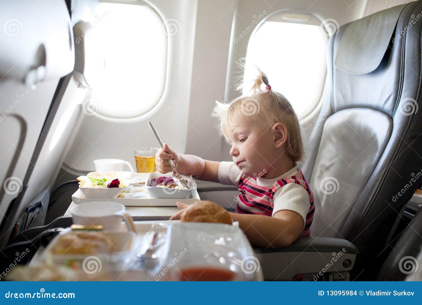 Eating in the airplane stock photo. Image of person, beautiful 13095984