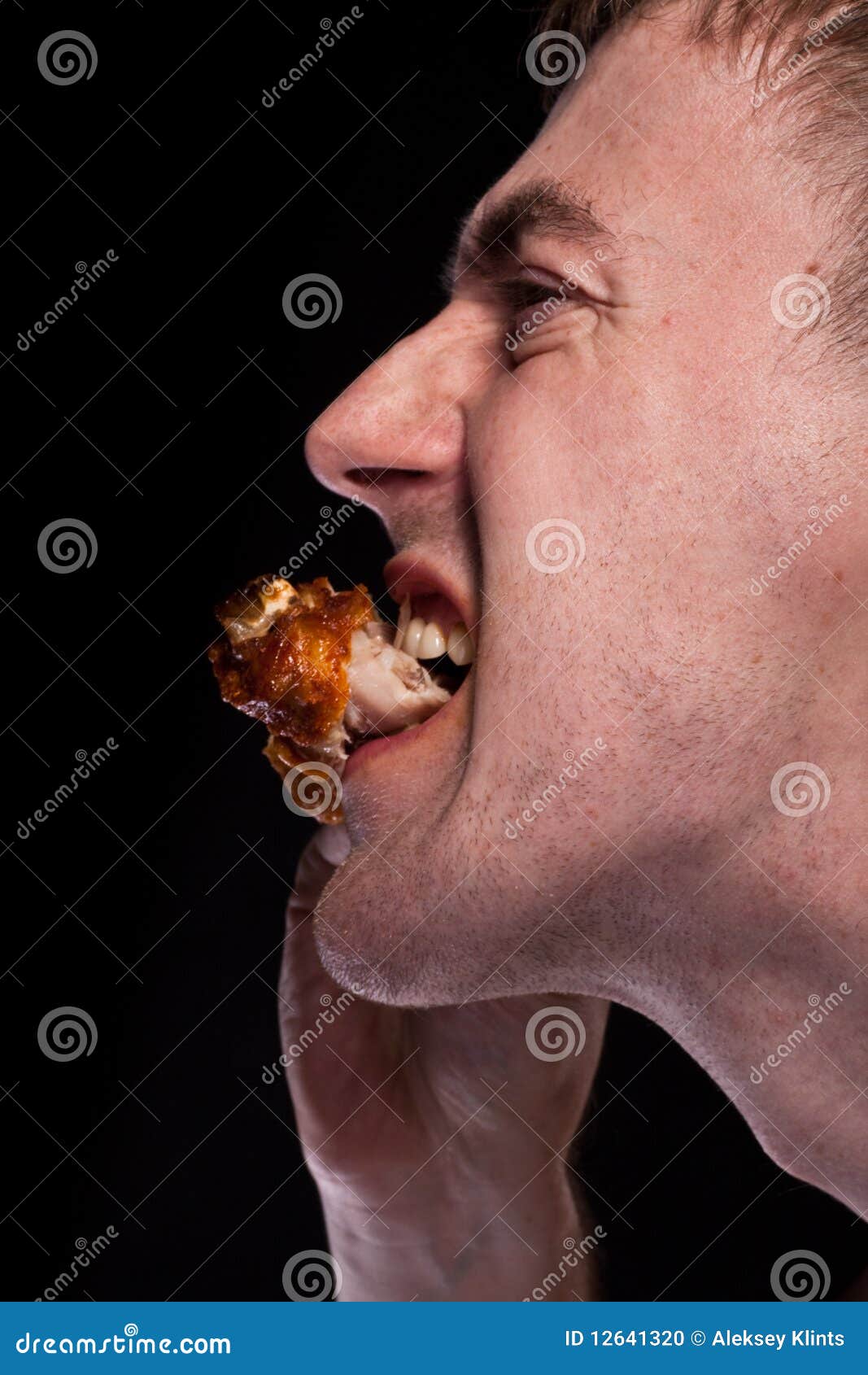 Eating chicken stock photo. Image of mouth, grilled, male 12641320