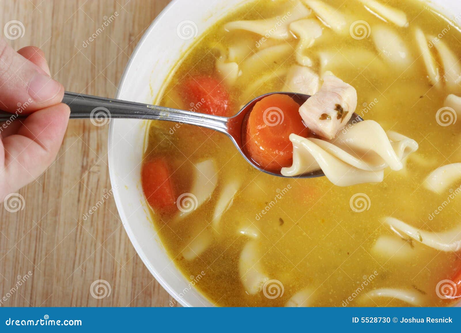 Eating Chicken Noodle Soup stock photo. Image of hand 5528730