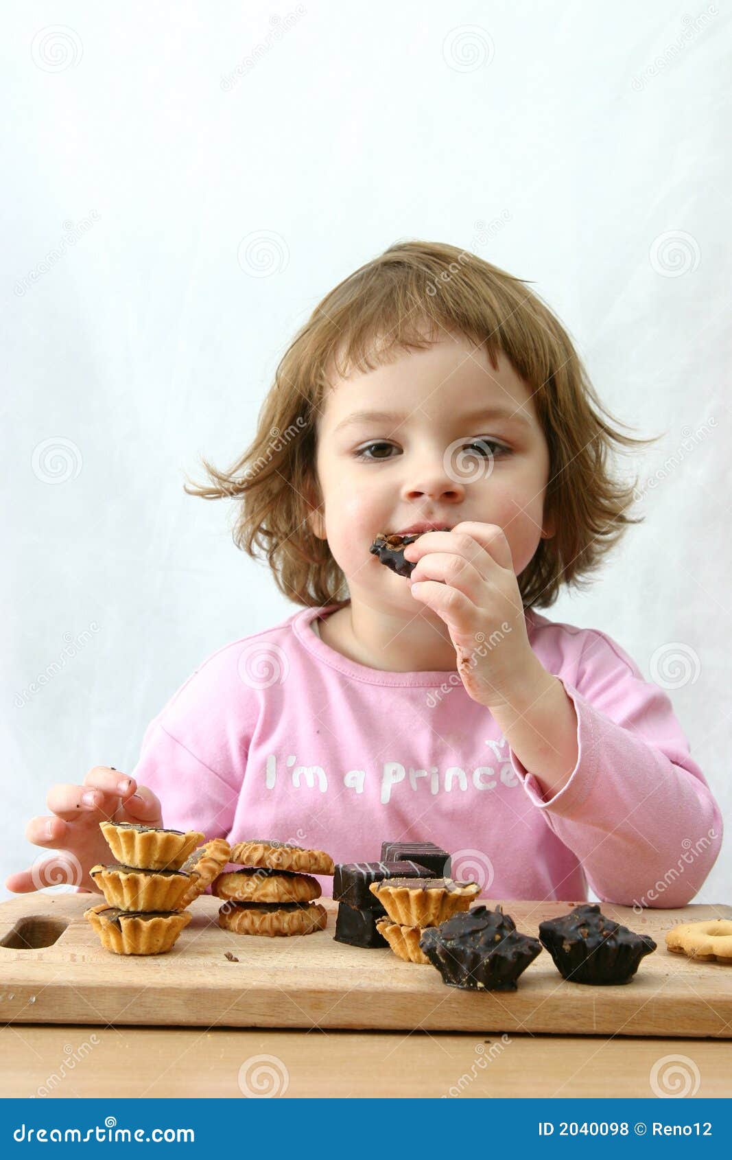 Eating chocolate cakes stock photo. Image of sweet, kids 2040098
