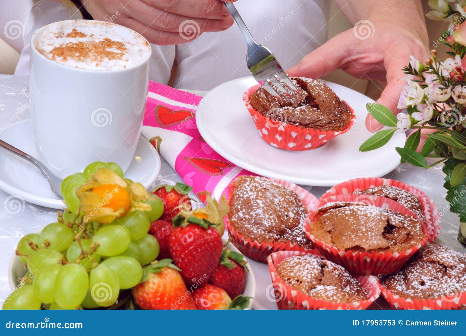 Eating a chocolate Muffin stock image. Image of breakfast 17953753