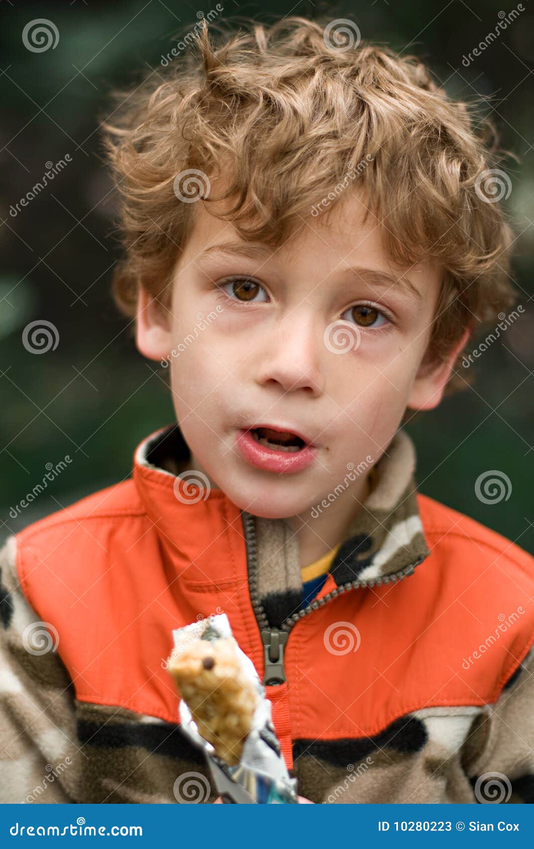 Eating a granola bar stock image. Image of closeup, eating 10280223
