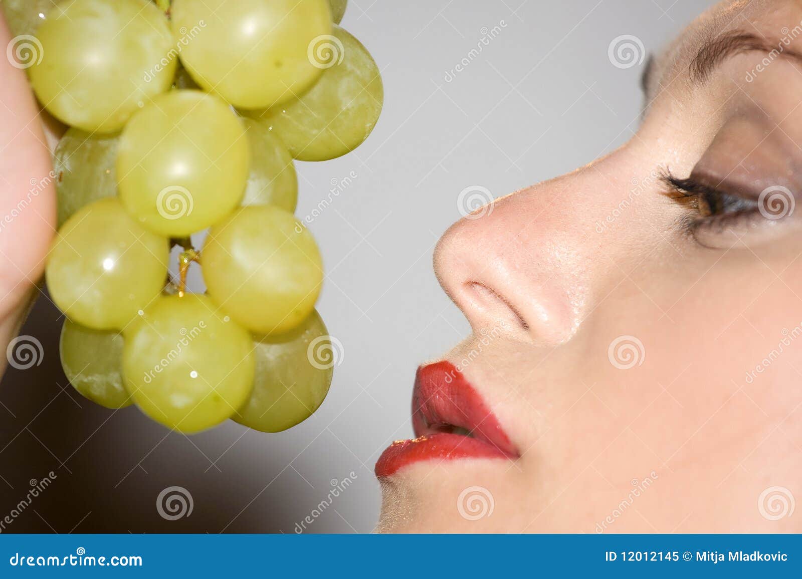 Eating grapes stock image. Image of female, portrait 12012145