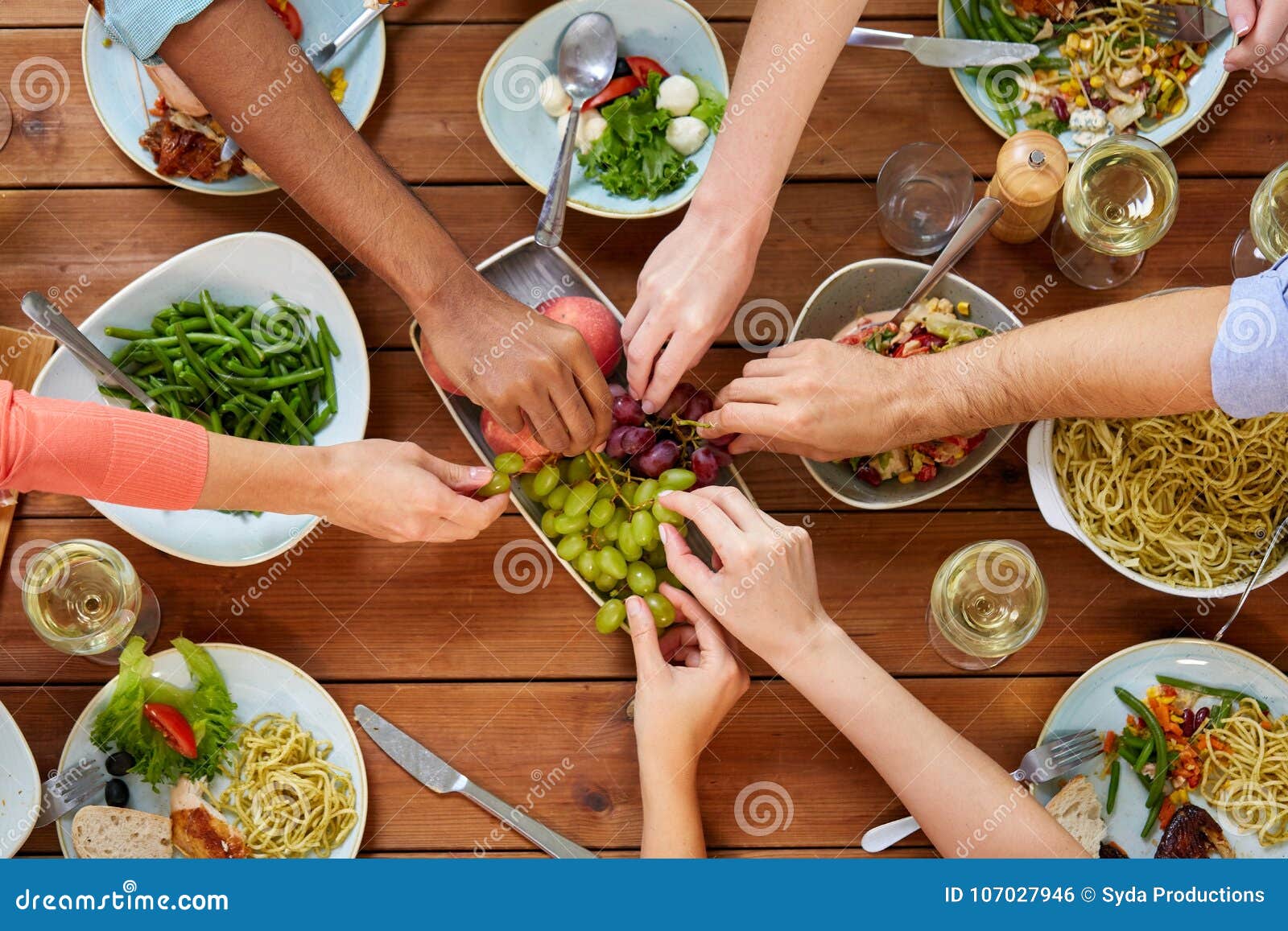 Group of People Eating at Table with Food Stock Photo - Image of