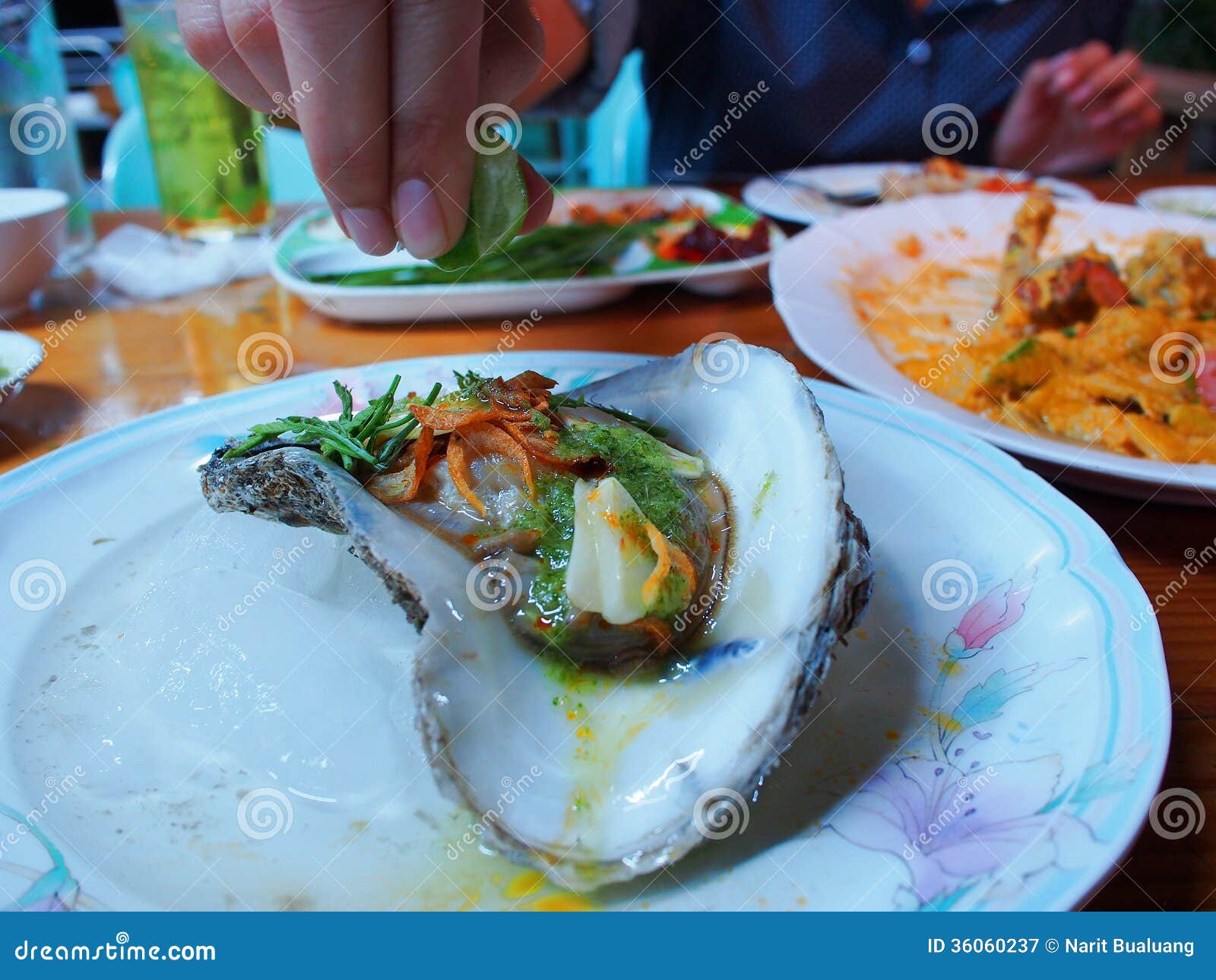 Eating raw oysters stock image. Image of meal, seafood 36060237