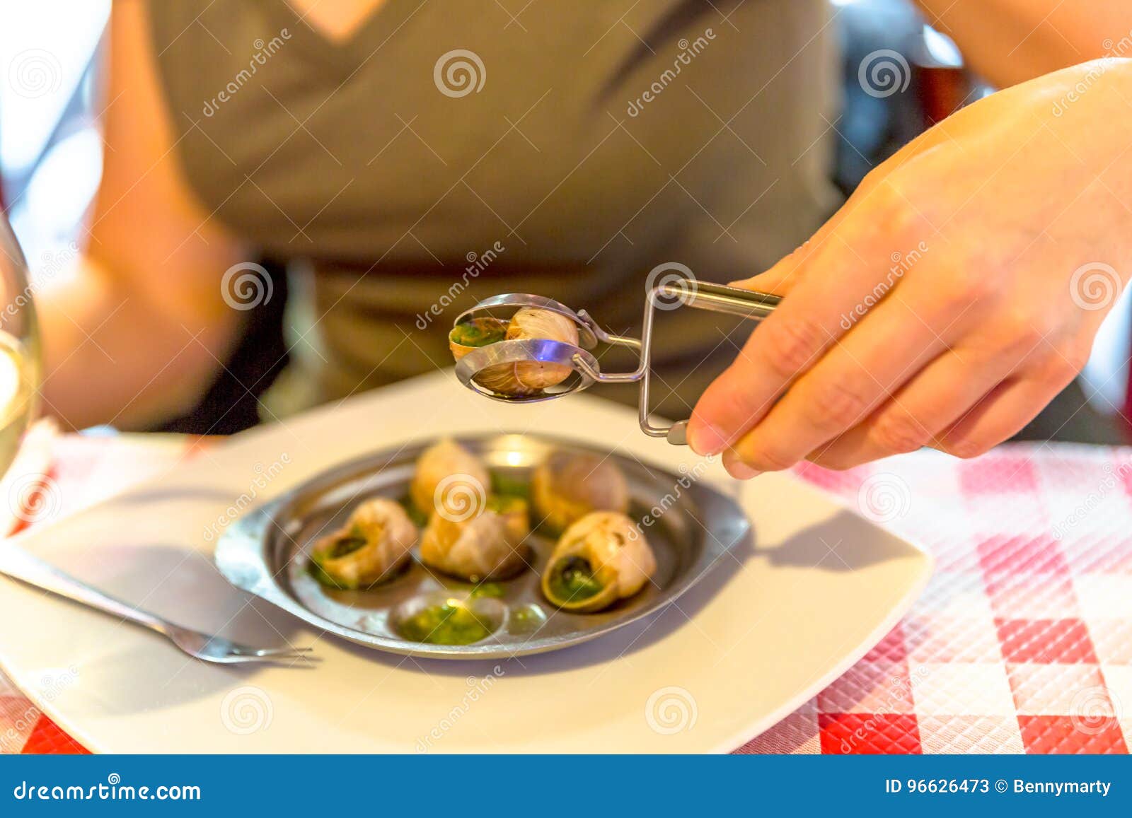 Eating snails in Paris stock image. Image of indoor, dish - 96626473