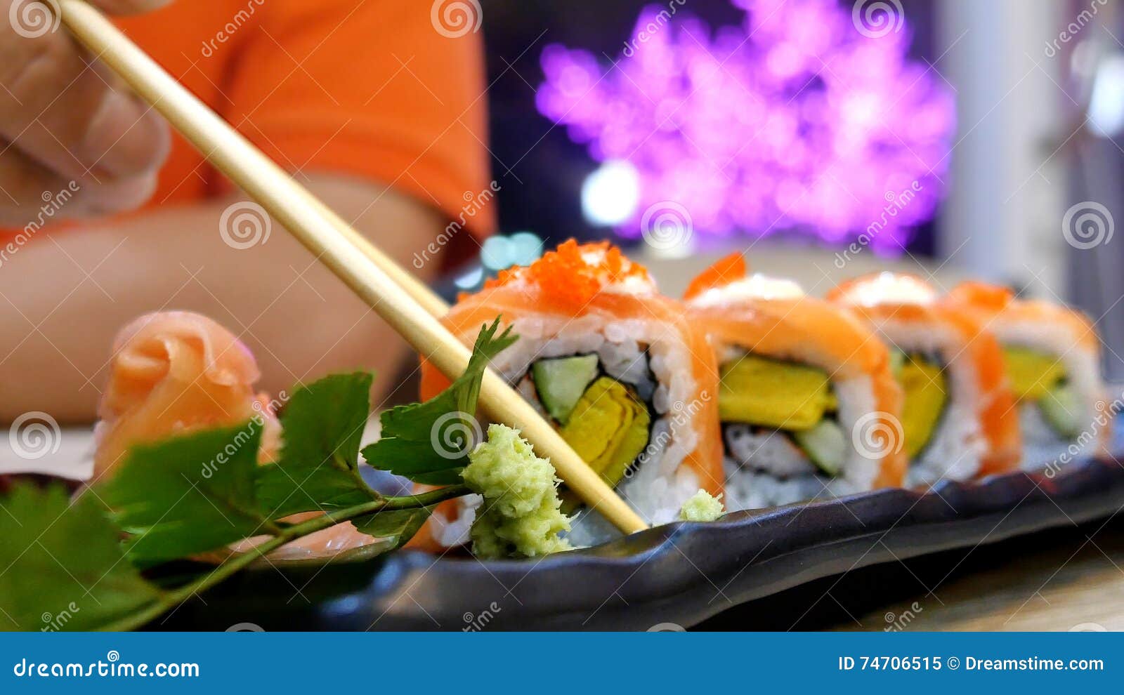 Eating Sushi Rolls In A Restaurant Stock Image - Image of healthy