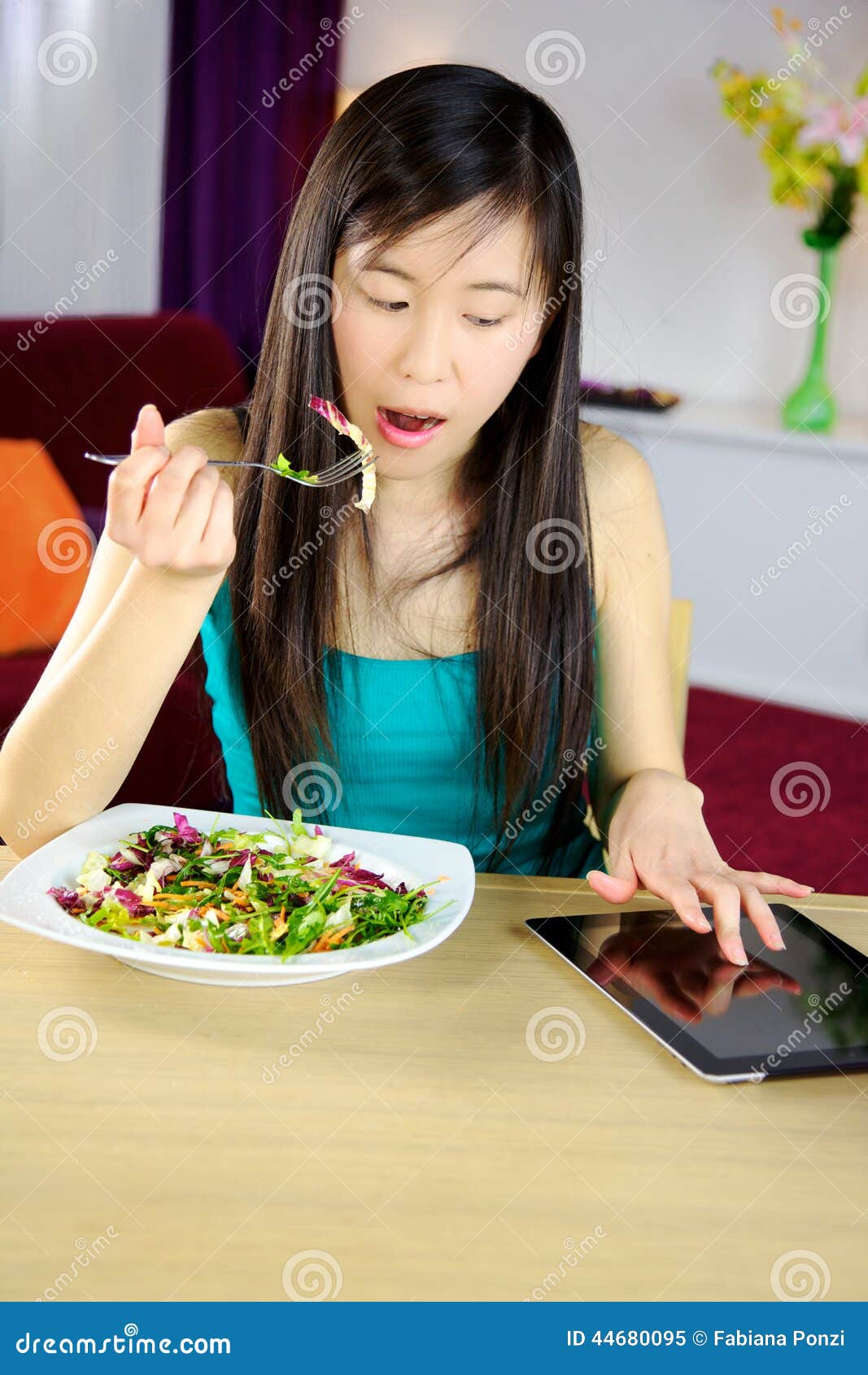 Eating with tablet stock image. Image of adult, asian 44680095